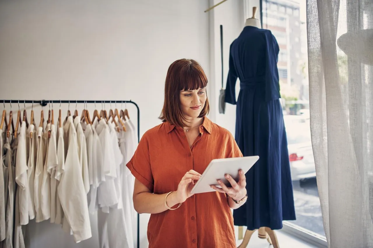 Cropped shot of a boutique owner using a digital tablet in her store.