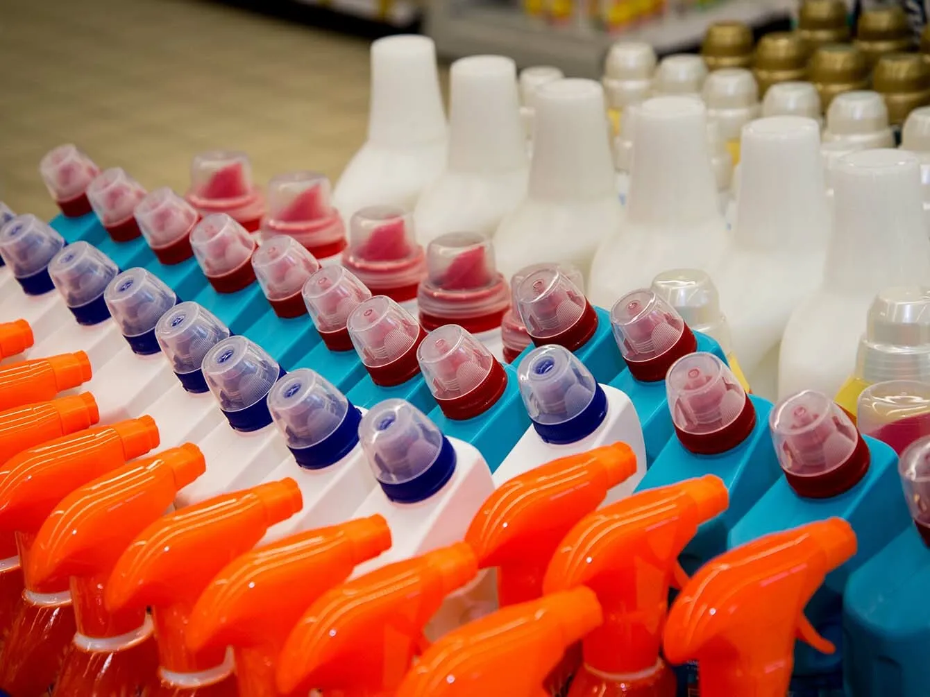 Organized retail shelf displaying various cleaning products, relevant to chemical industry logistics and distribution