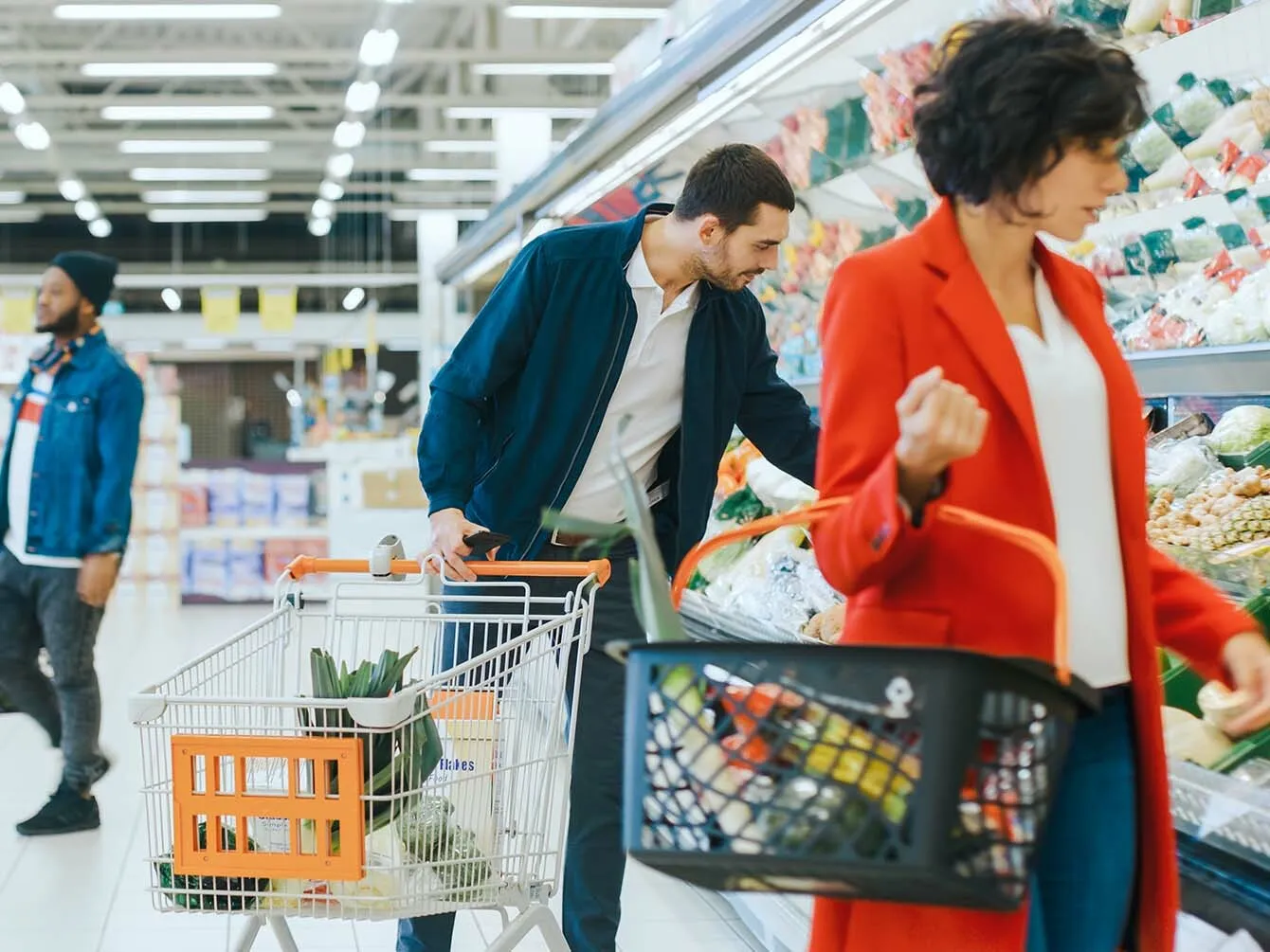 Customers shopping vegetables at the supermarket