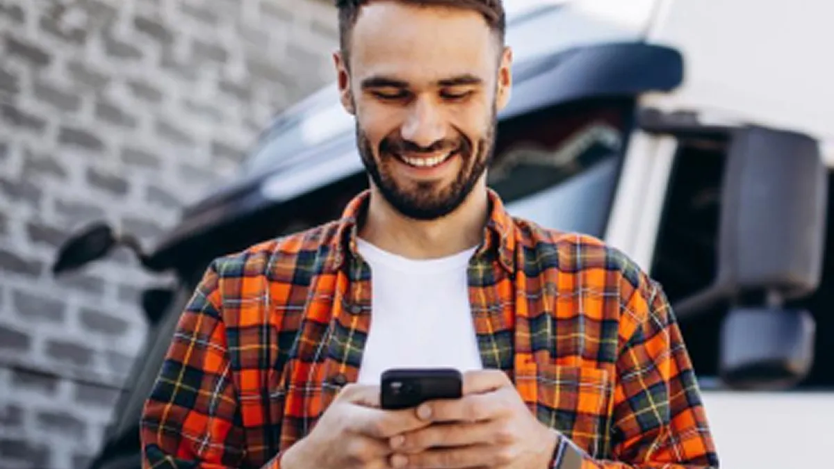 Client looks at road carrier solution on mobile phone