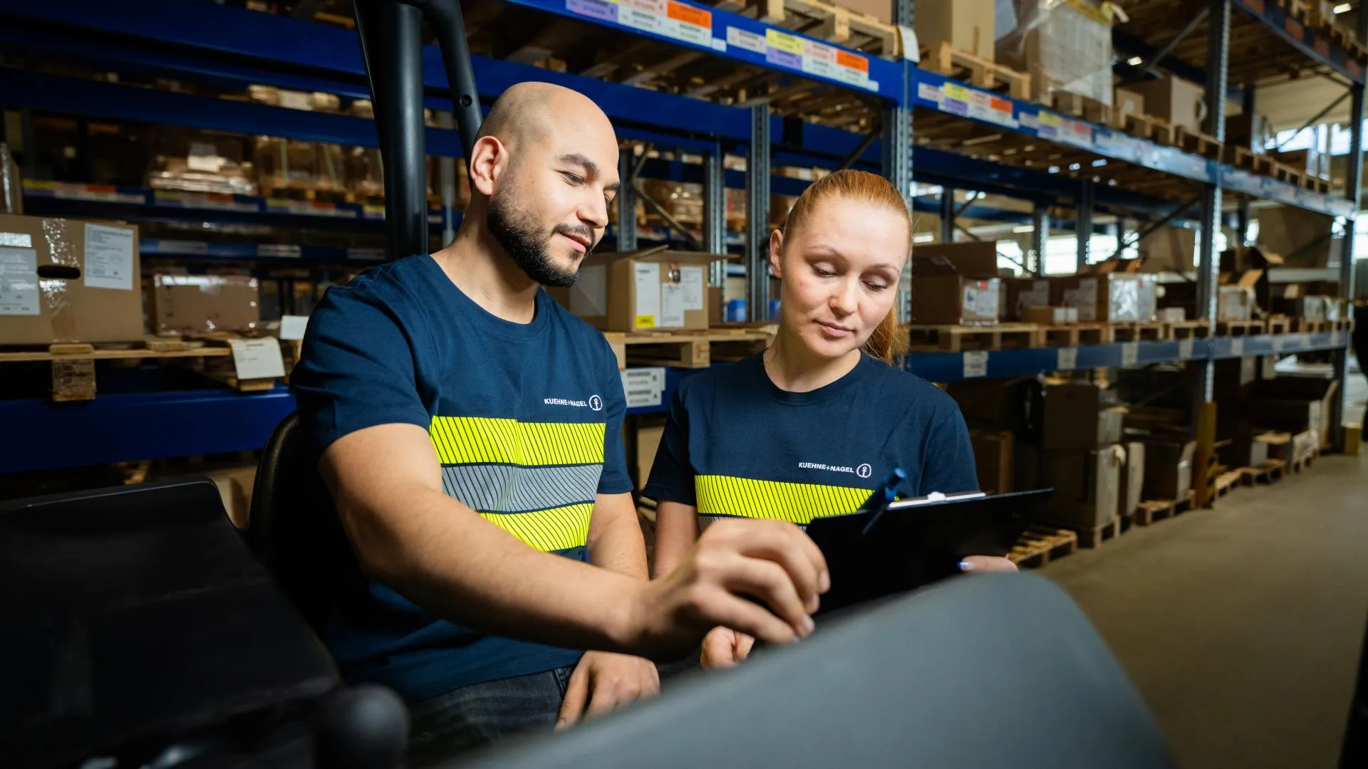 Male and female workers in a warehouse
