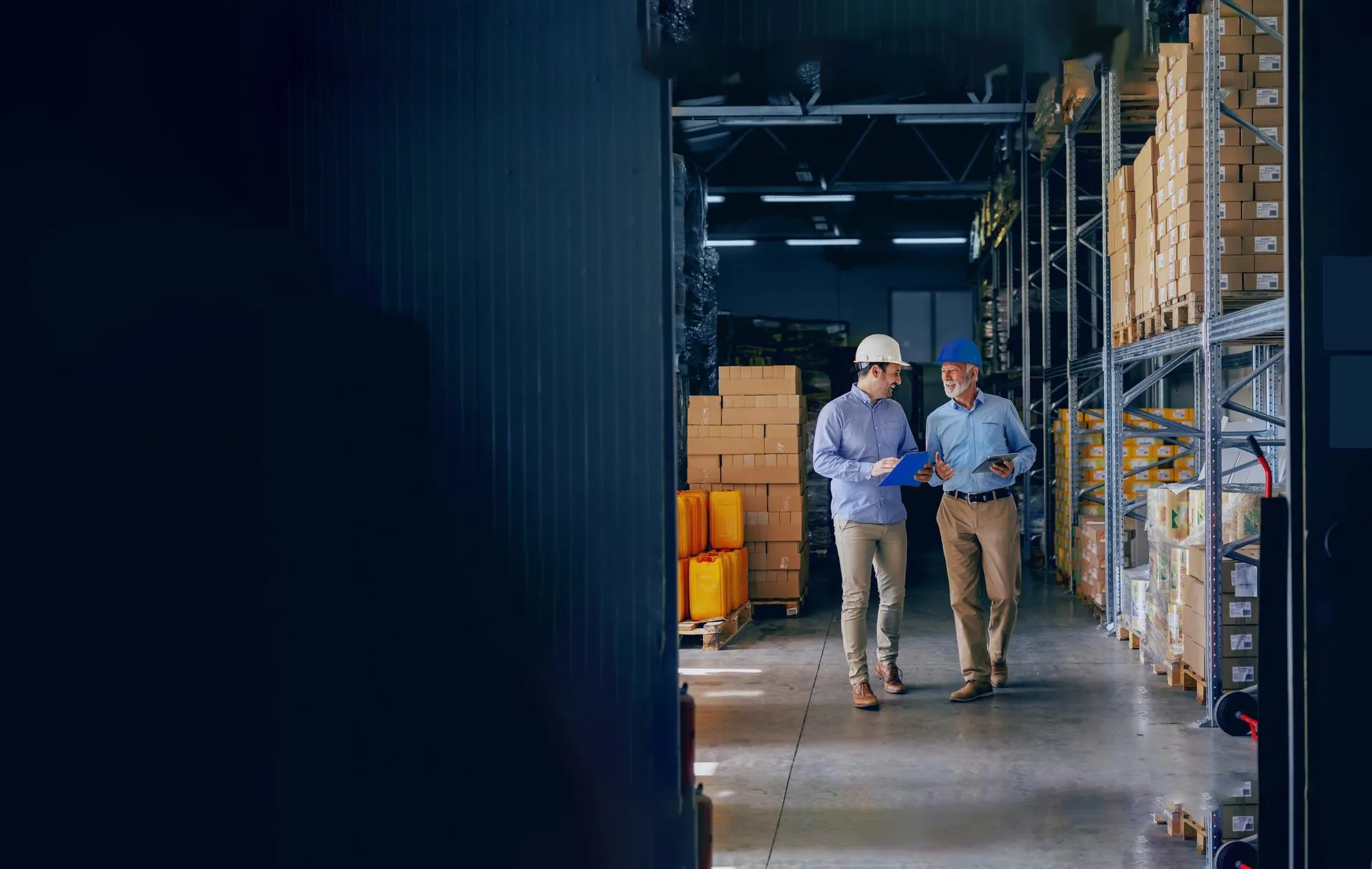 A pair of specialists is making their way through the storage facility.