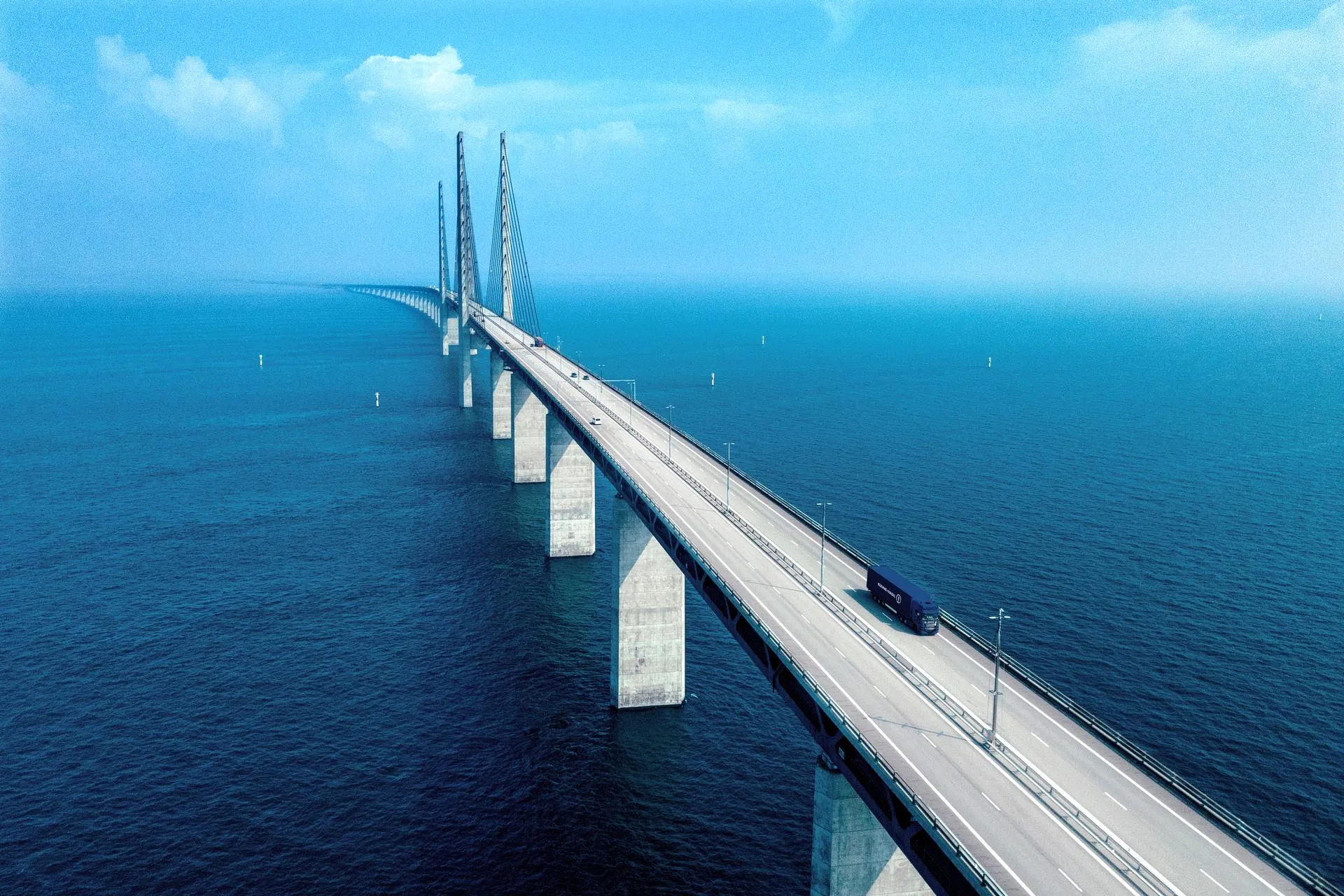 A Kuehne+Nagel truck crossing a bridge