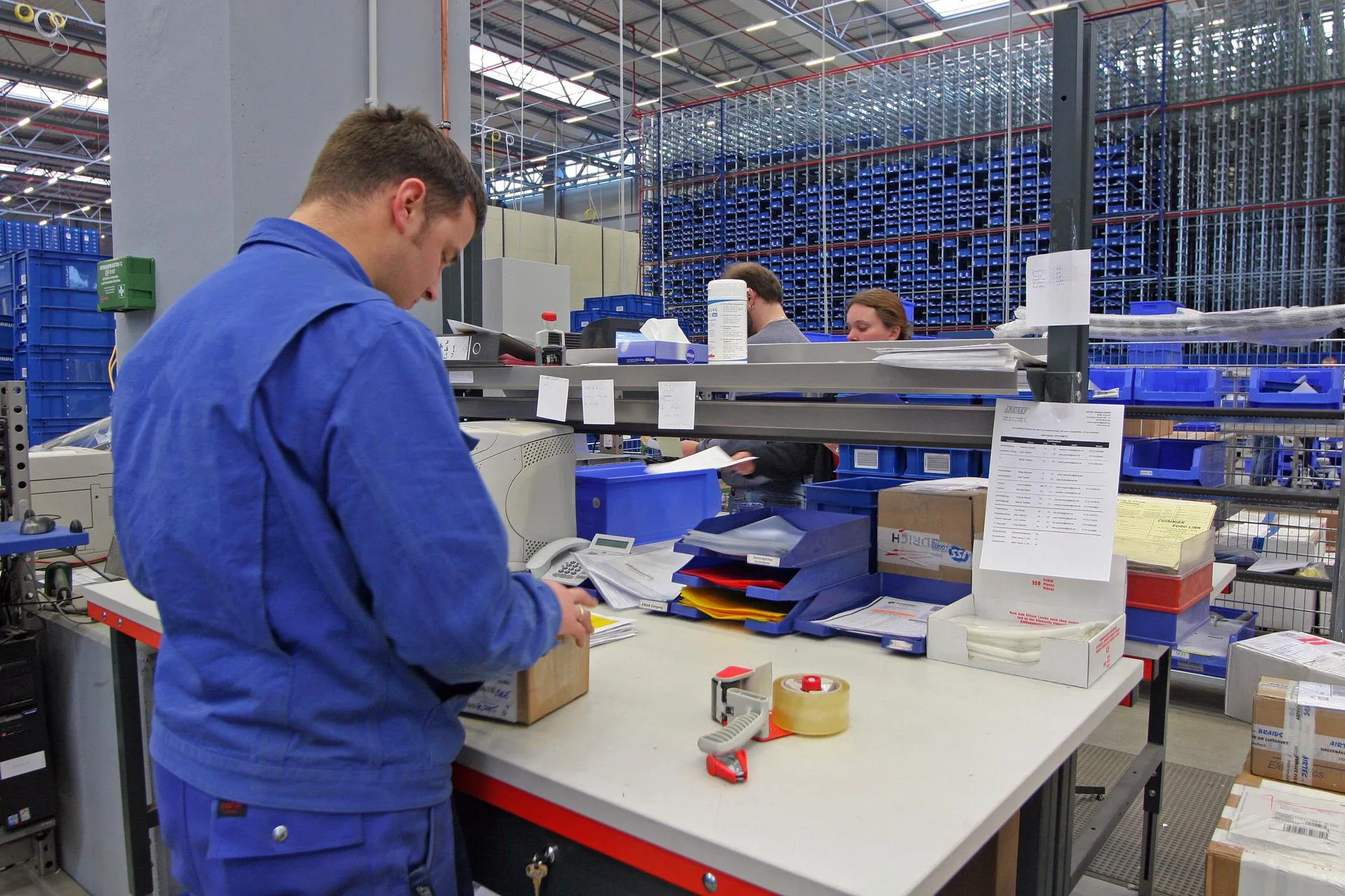 Employees carefully packing packages for shipment