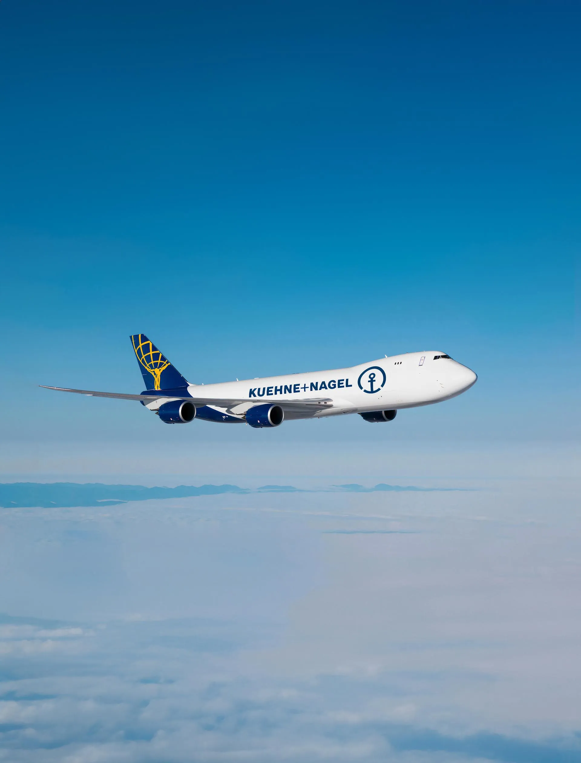 Kuehne+Nagel Boeing 747 flying above the clouds