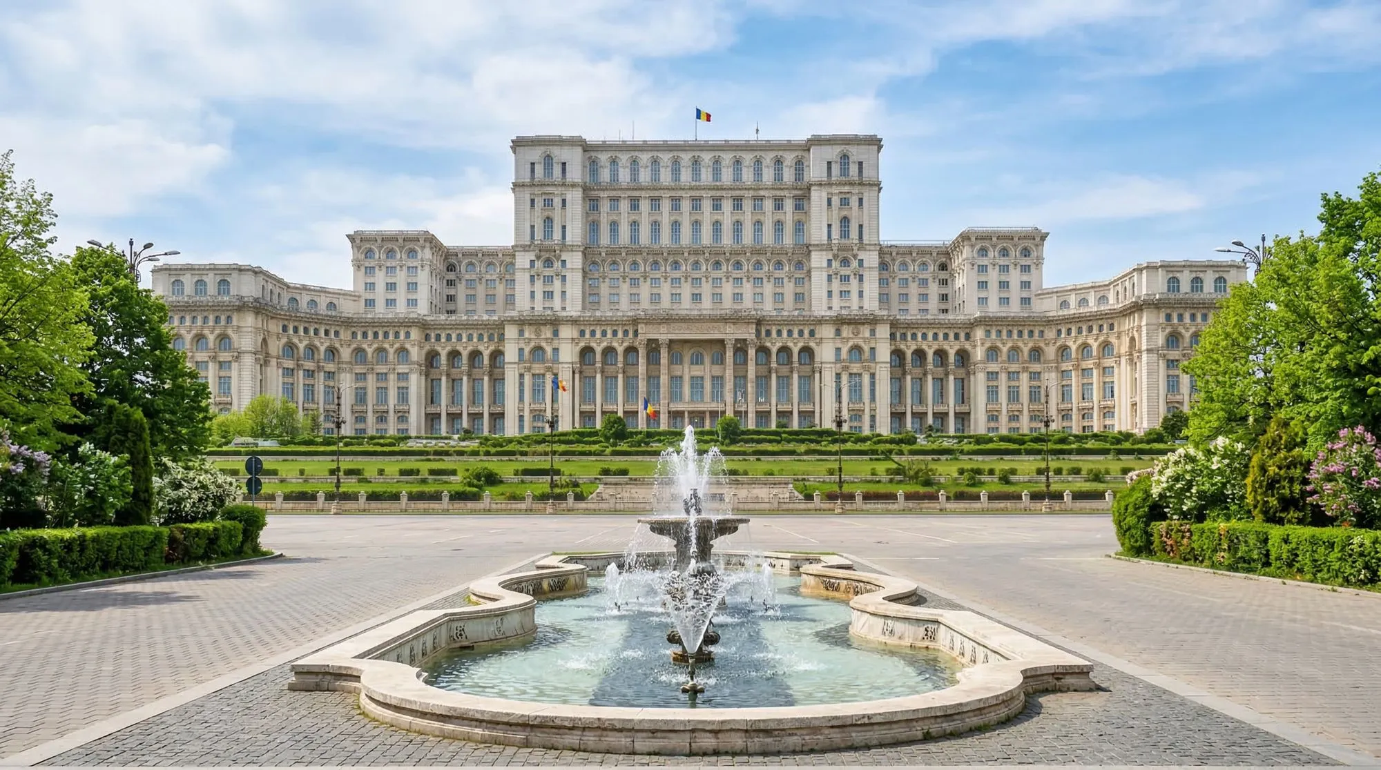 Front view of Casa Poporului with fountain in the foreground