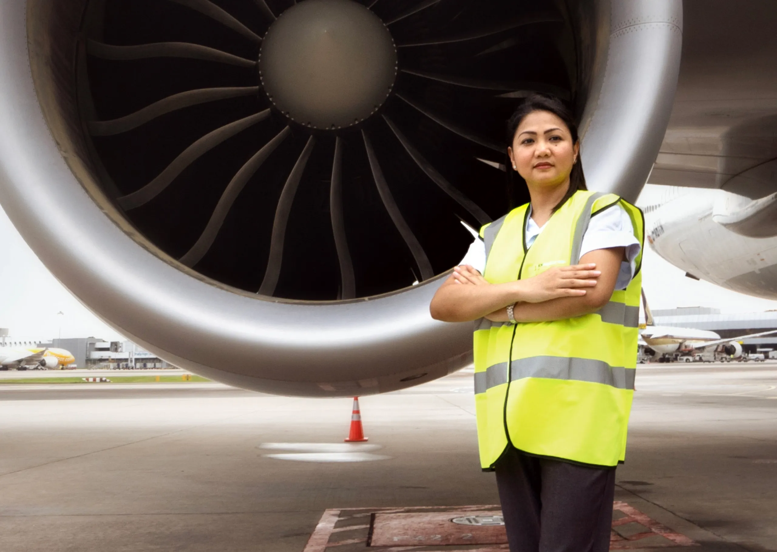 An engine logistics experts standing in front of an engine