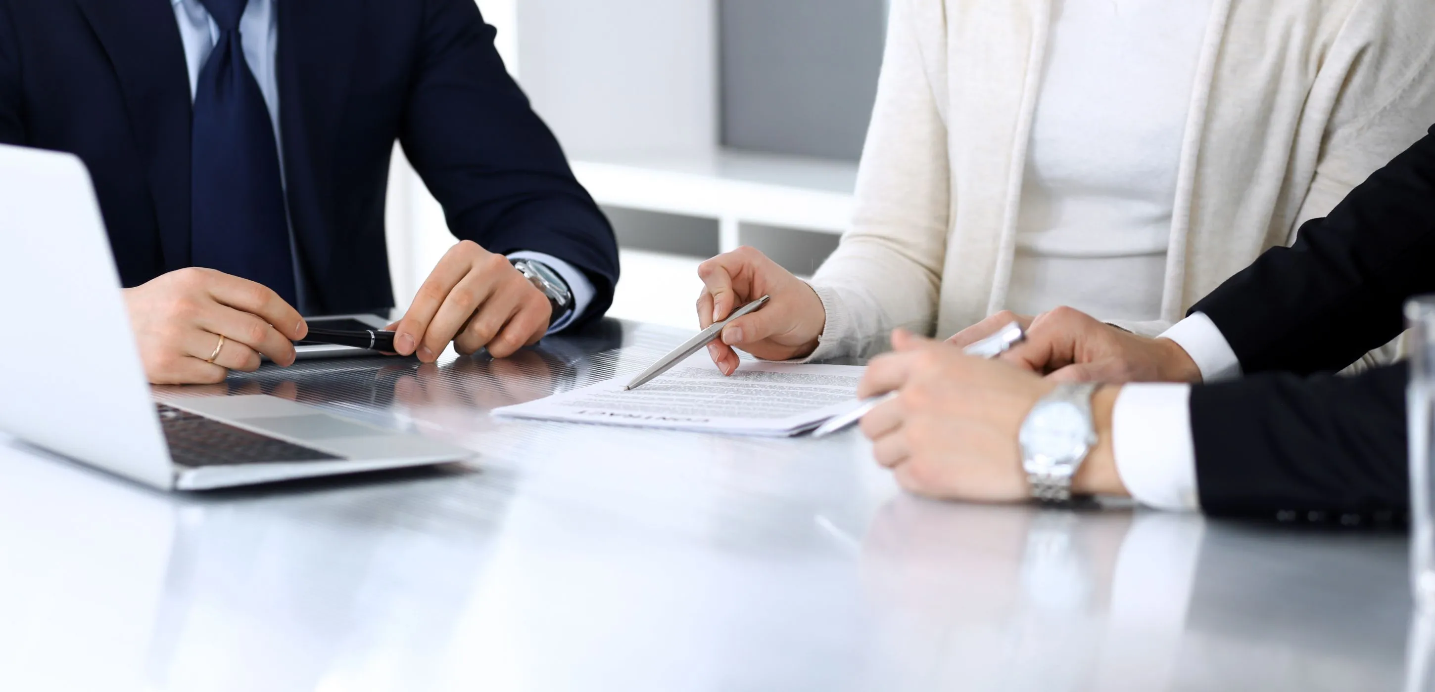 Business people discussing contract at meeting