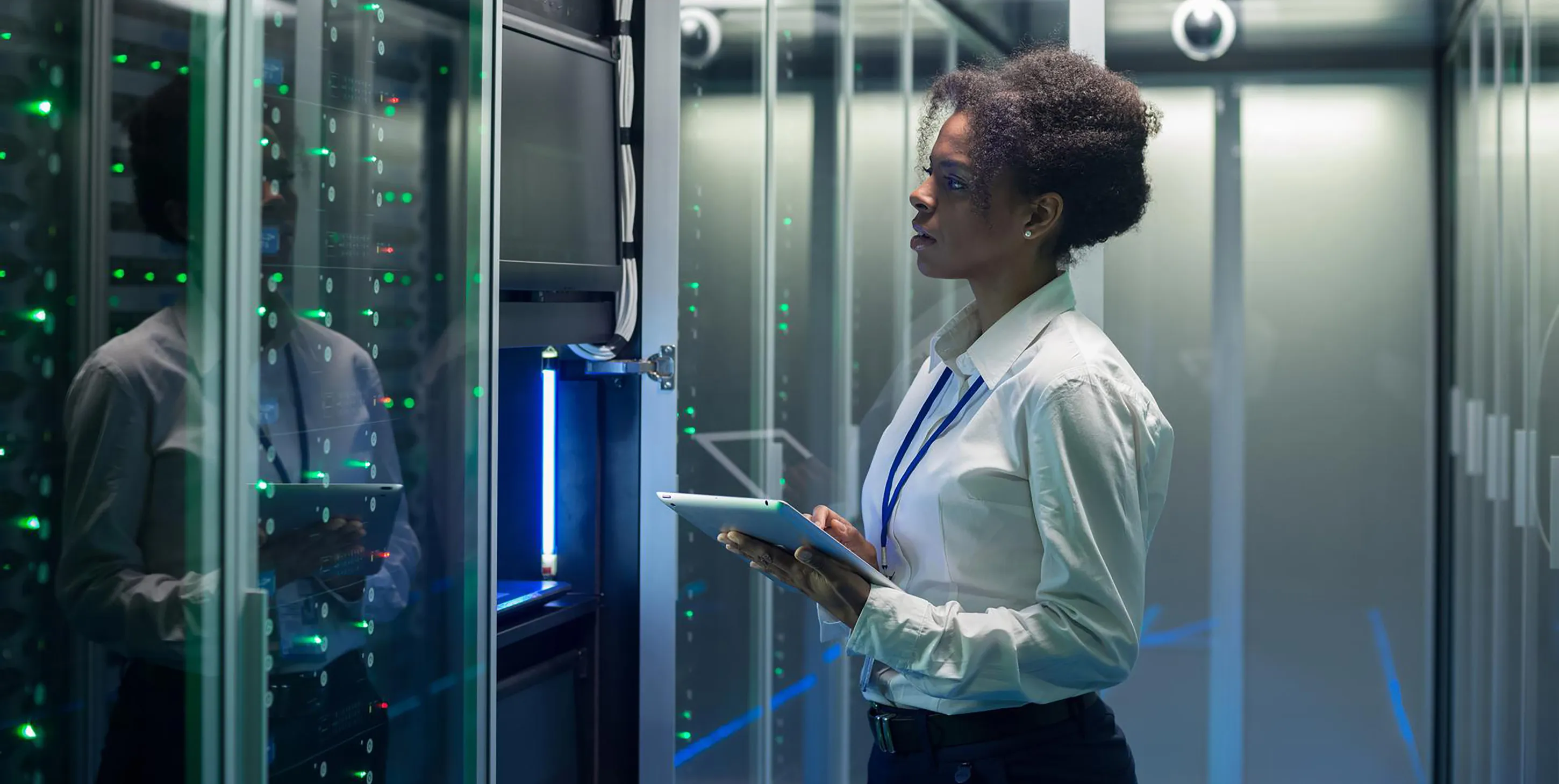 Woman in front of a data server rack