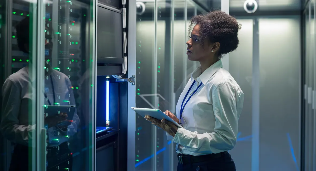 Woman in front of a data server rack