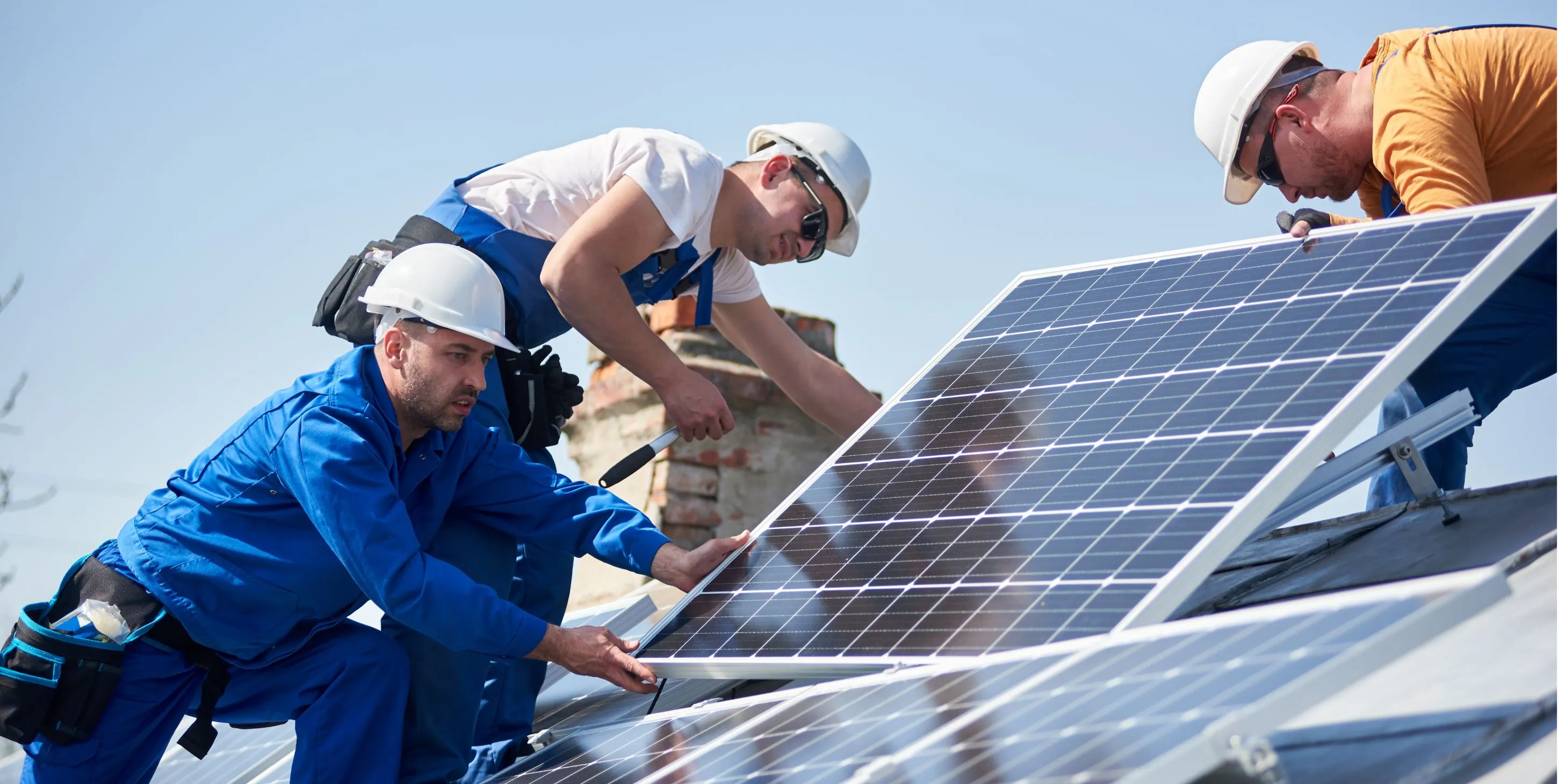 Team engineers installing solar panel