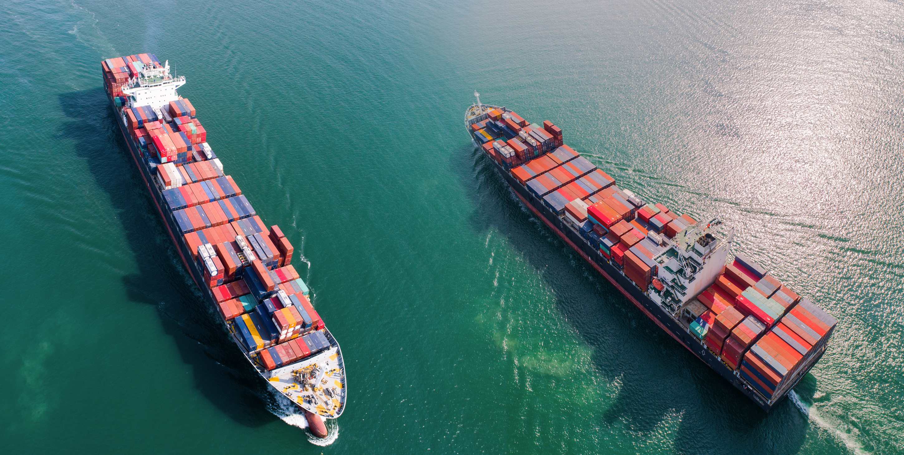 Two large container ships sailing in the ocean