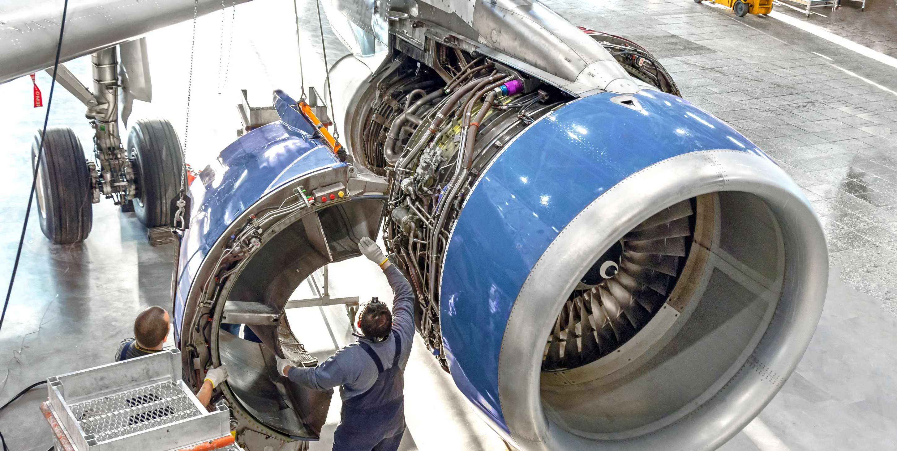 aerospace workers working in an engine