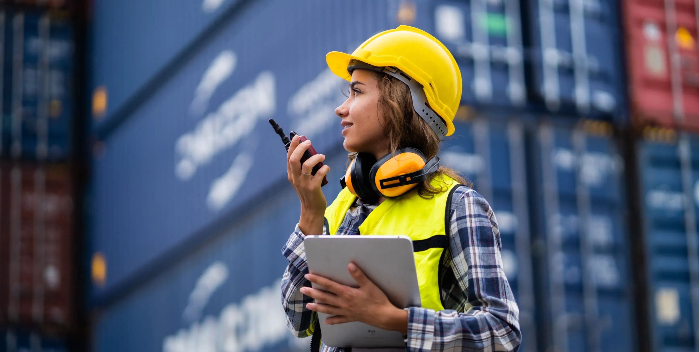 Worker lady and cargo containers