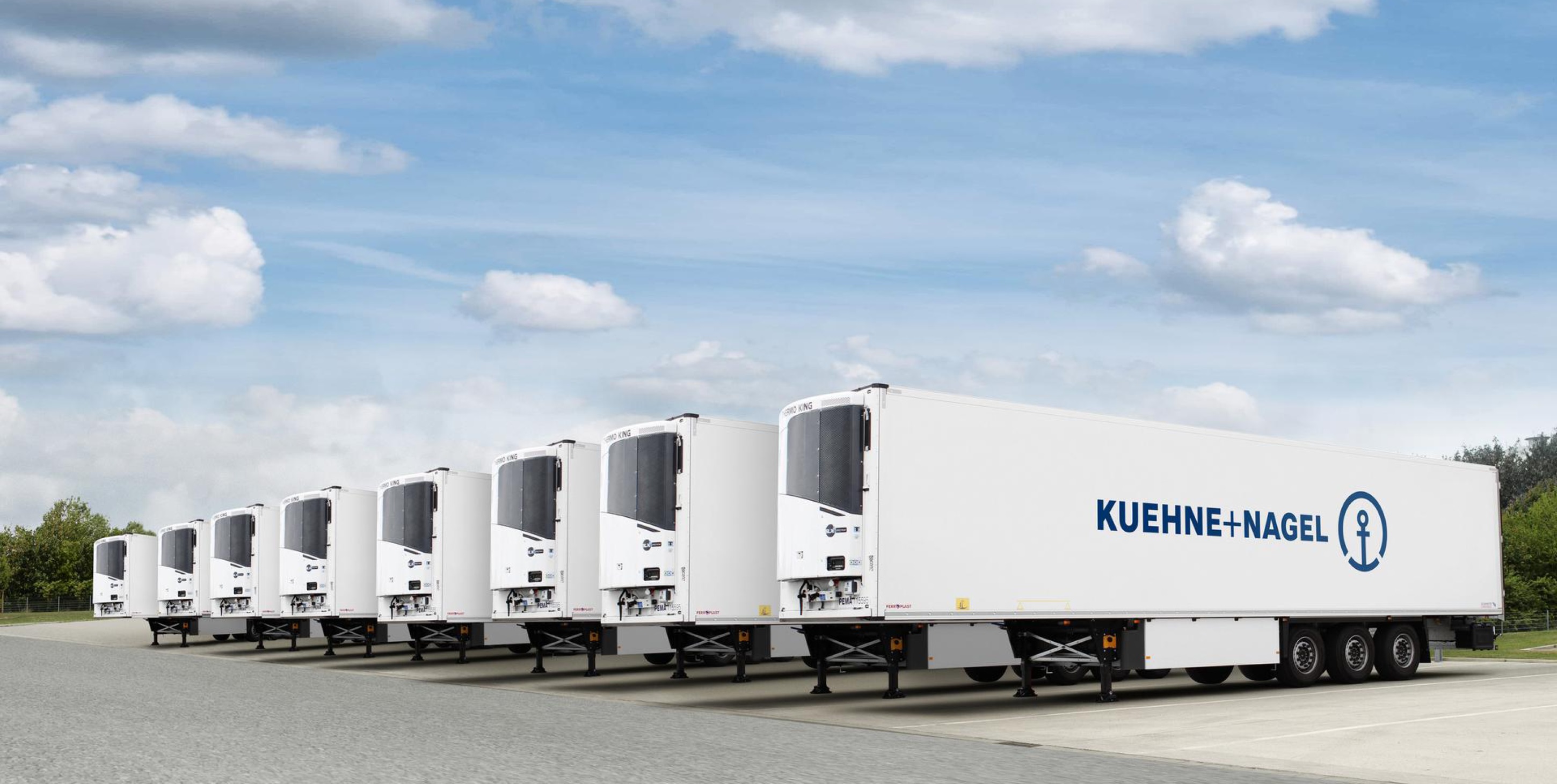 eight refrigirator truck backparts parked in line