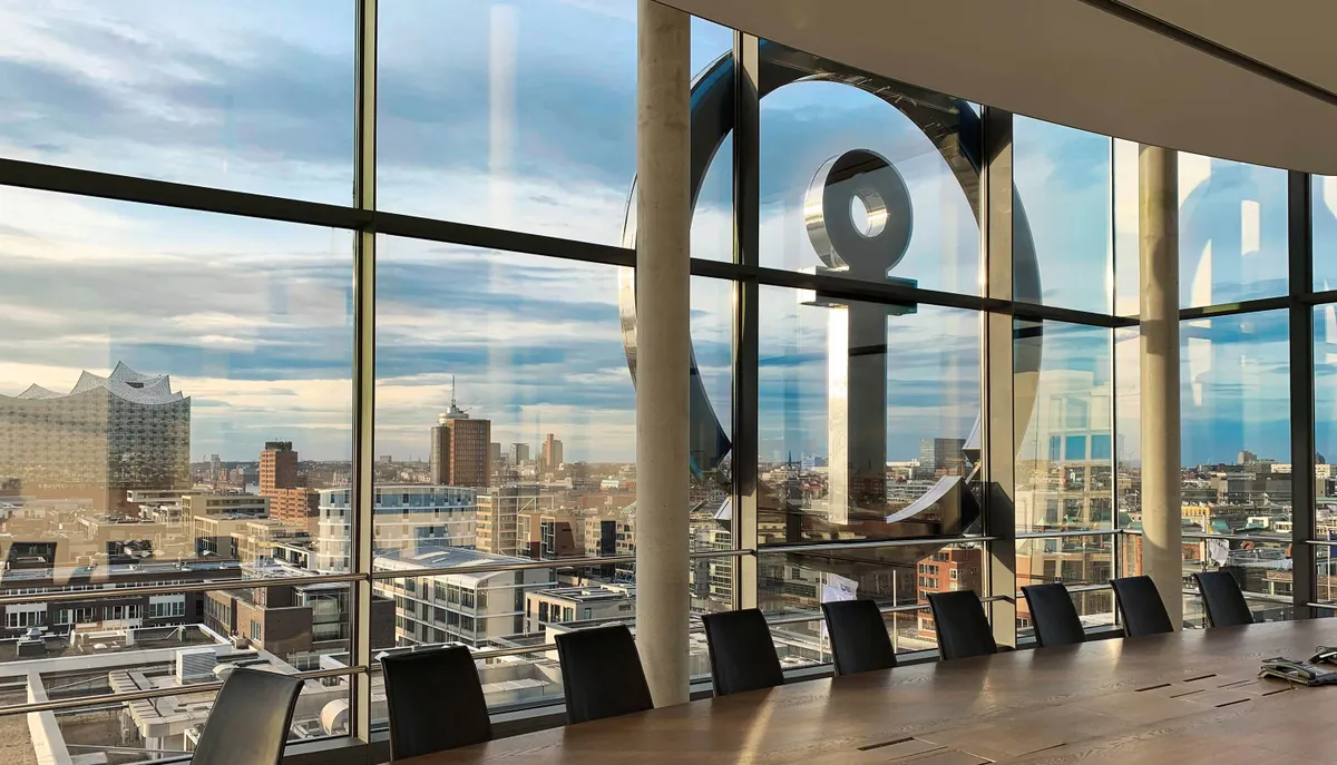 View of the Elbphilharmony and Hamburg skyline from the Kuehne+Nagel office with Kuehne+Nagel anchor in fromt of the window