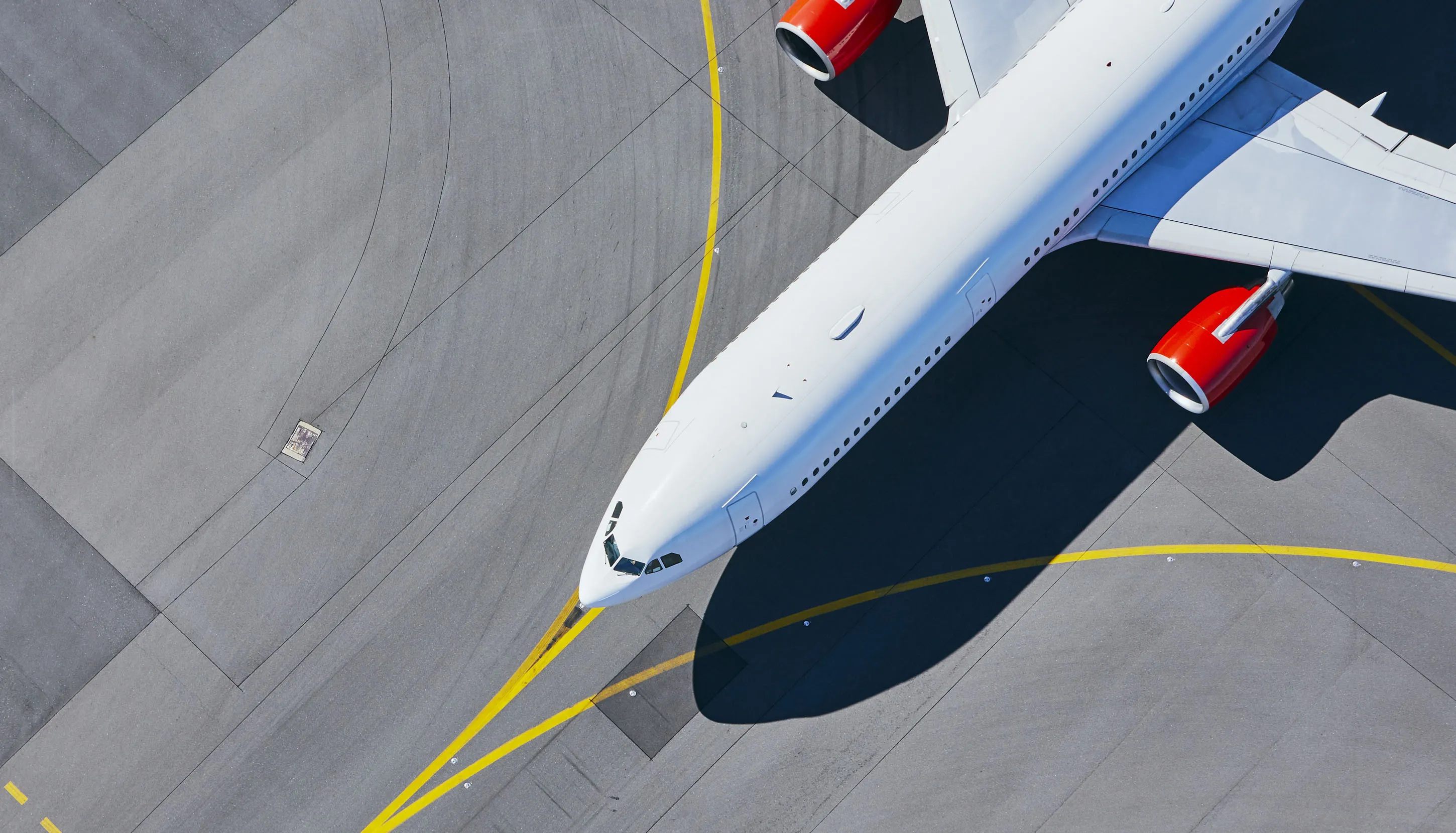 A large white airplane on the runway, ready for takeoff