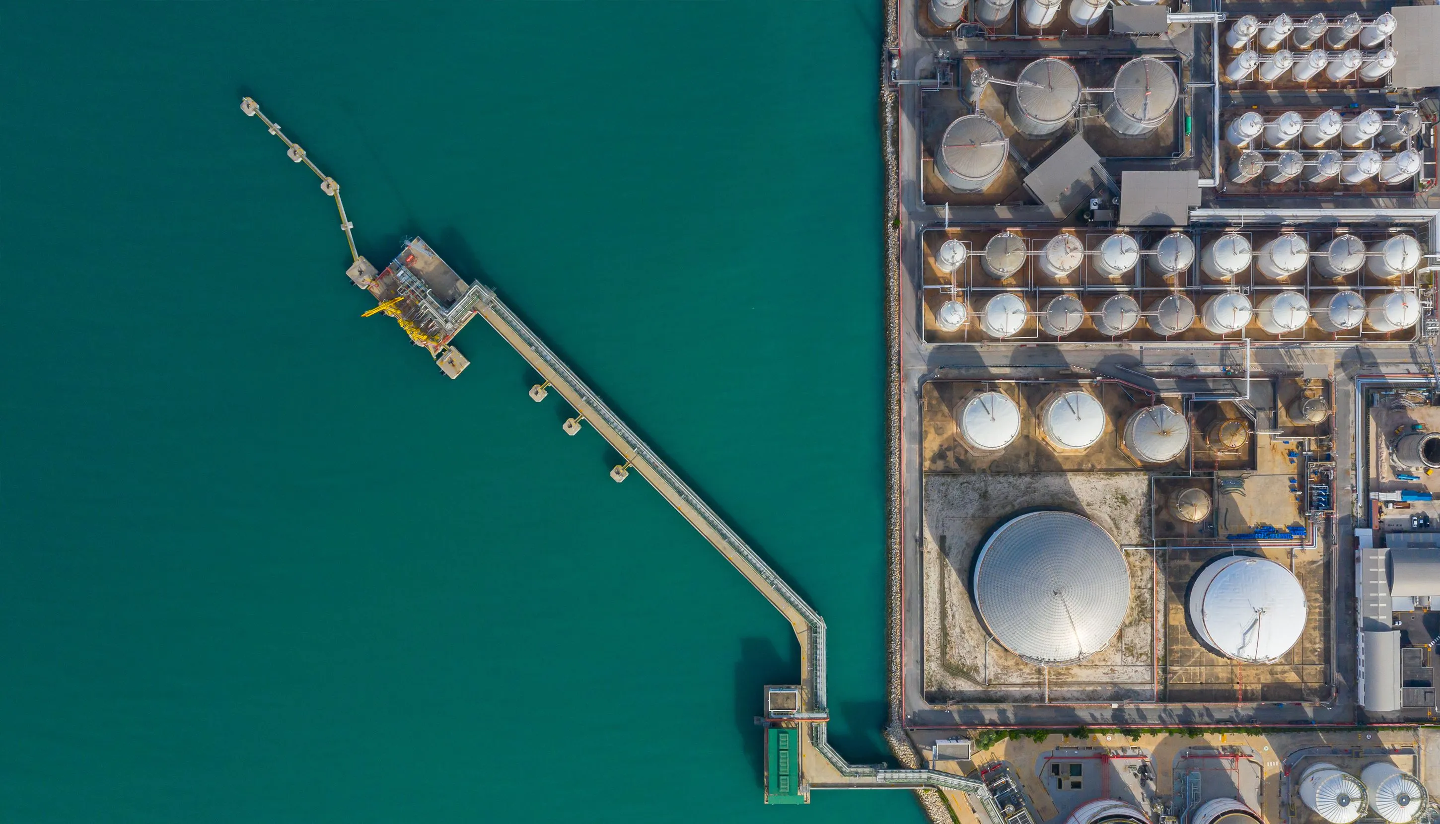 Aerial view of an oil platform at the coast