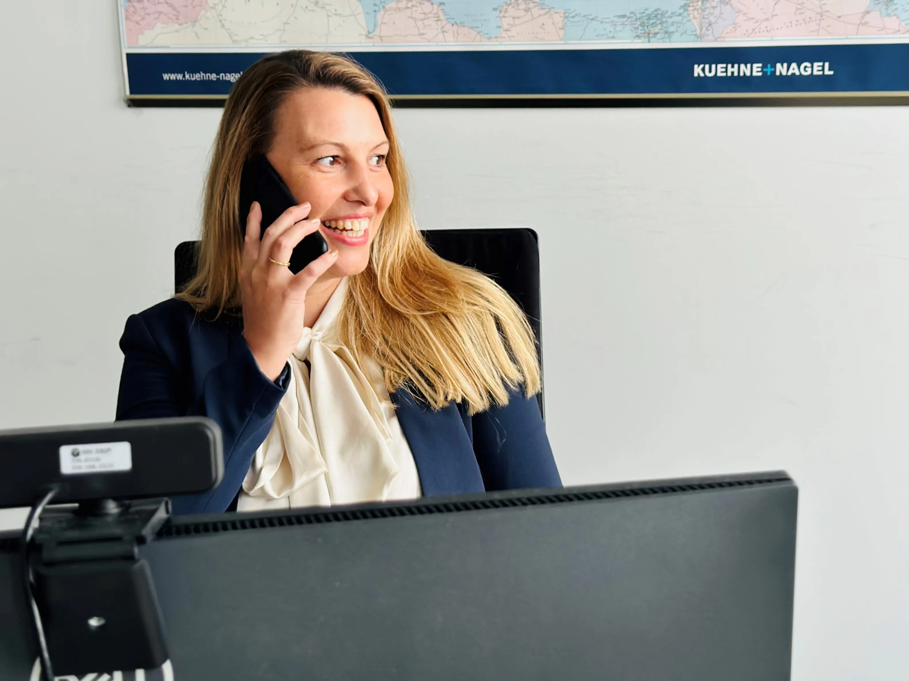 Julia Westerholt, Consumer Global Key Account Manager at Kuehne+Nagel talking at the phone and watching over
