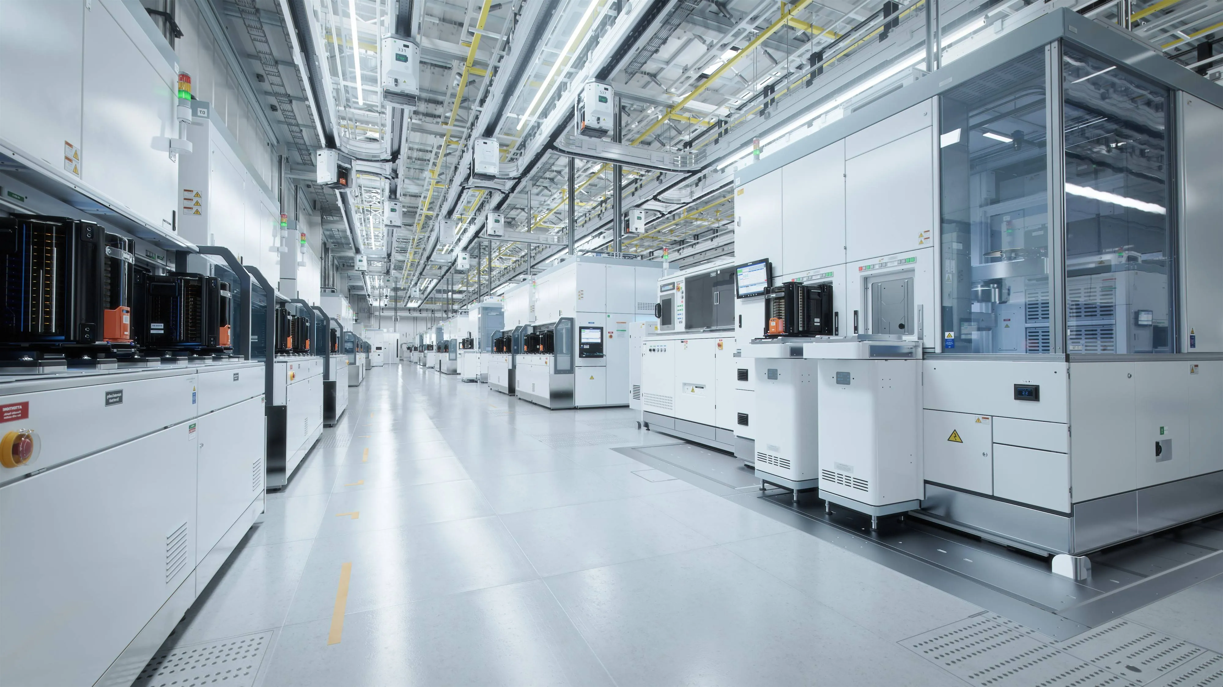 Semiconductor fab cleanroom featuring advanced manufacturing equipment and automated production tools used in semiconductor fabrication.