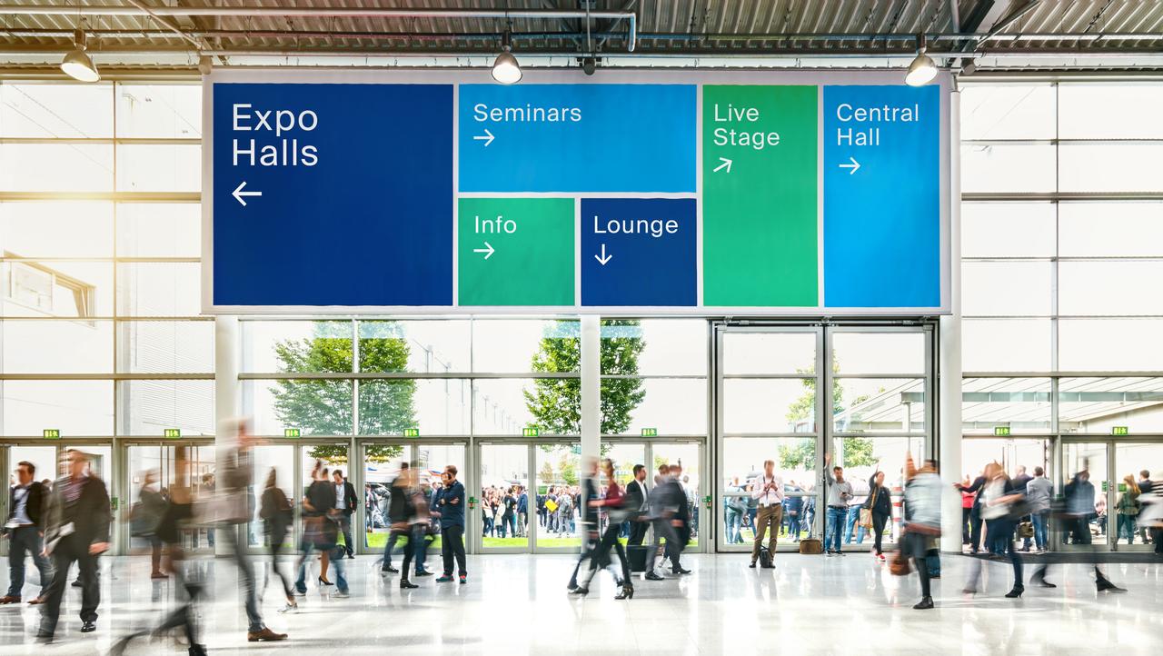 Anonymous crowd of business people at a trade fair