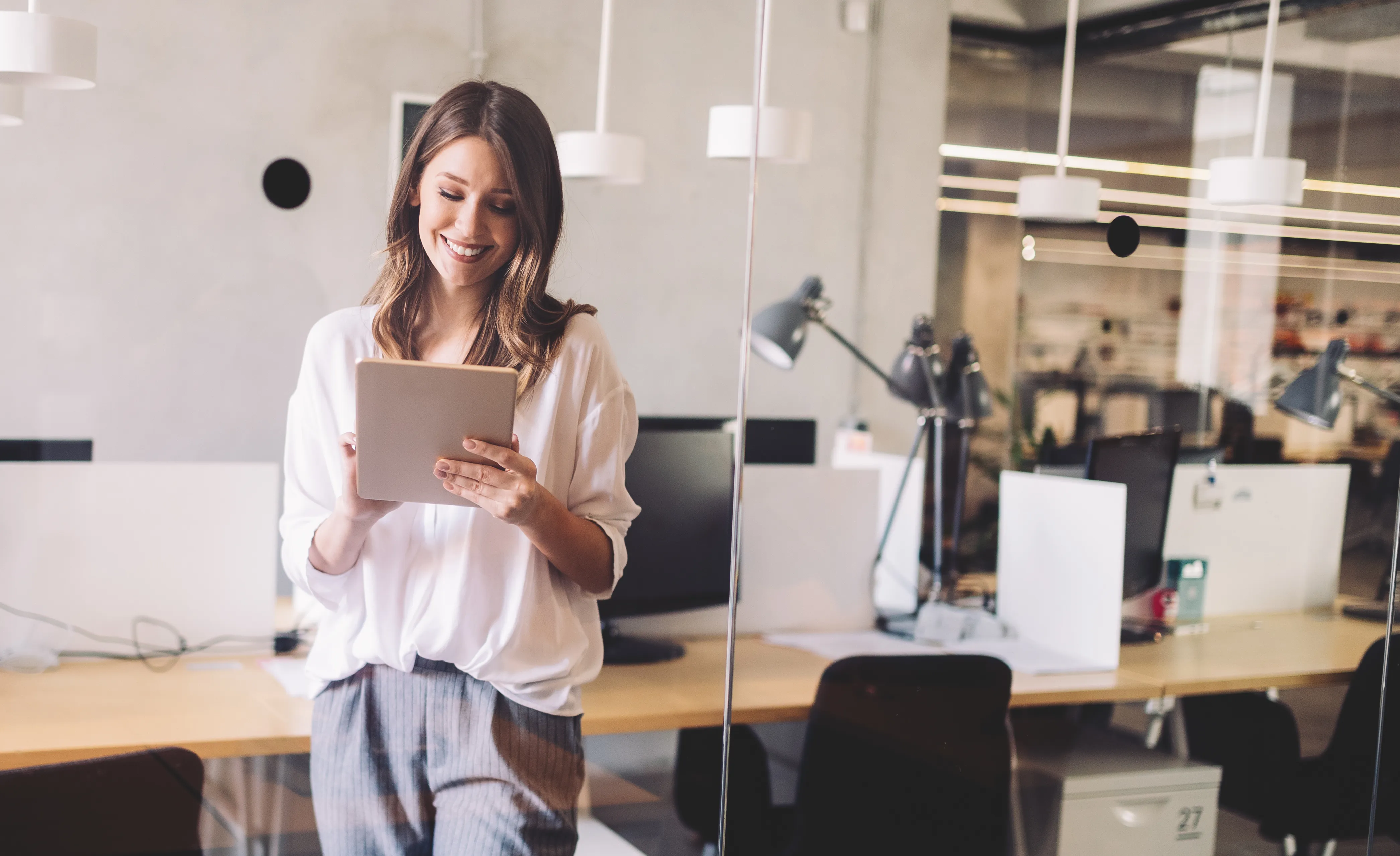Lady in office using tablet