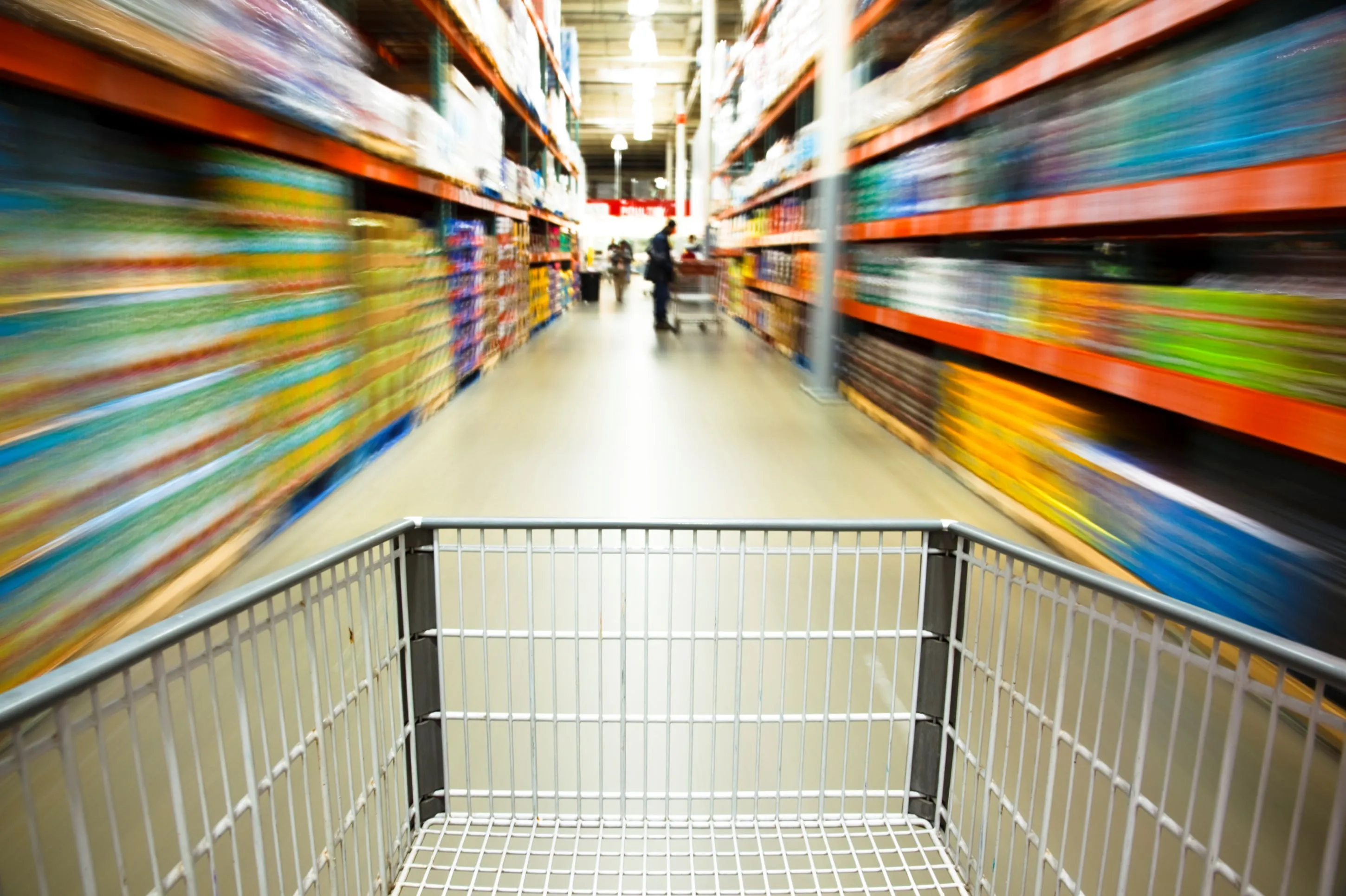 Shopping cart point of view in the supermarket, rushing through the corridor