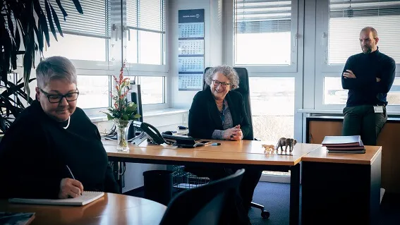 Petra, Kerstin and Christian having a meeting in the office
