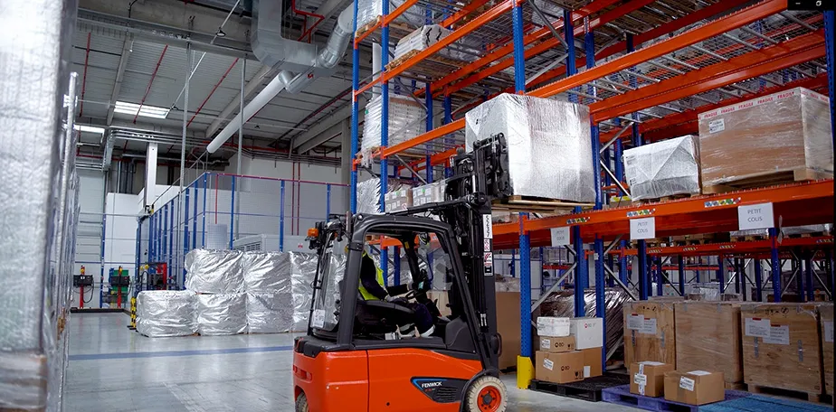 Warehouse with car and pallets and temperature-controlled storage