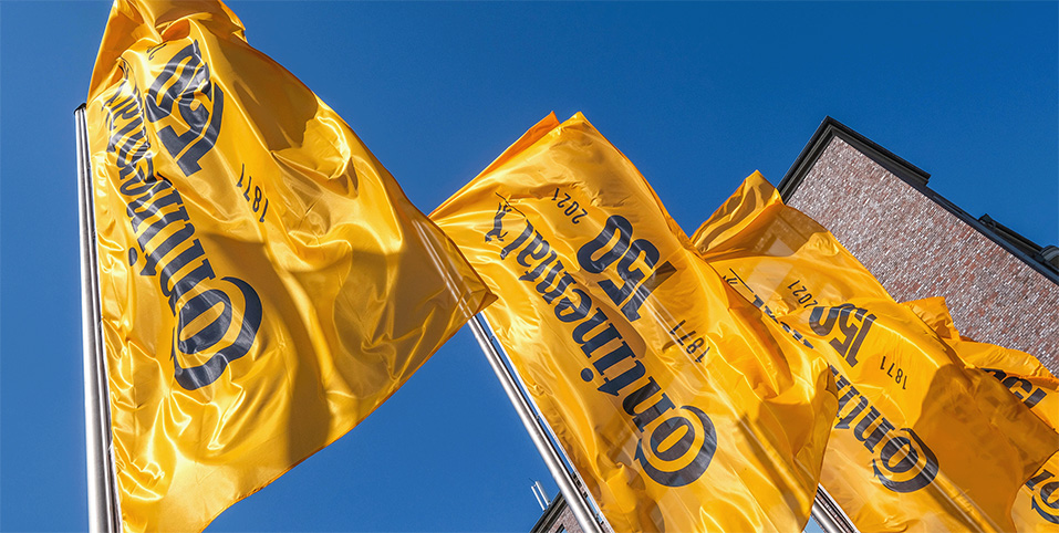 Four yellow Continental flags shot from below.