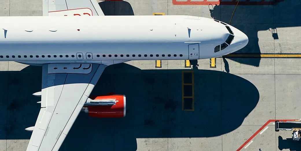 Plane at a gate captured from above