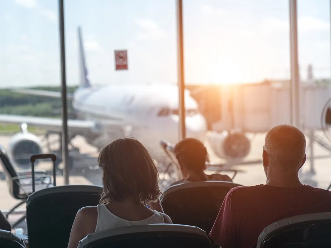 People patiently waiting at the gate on airport