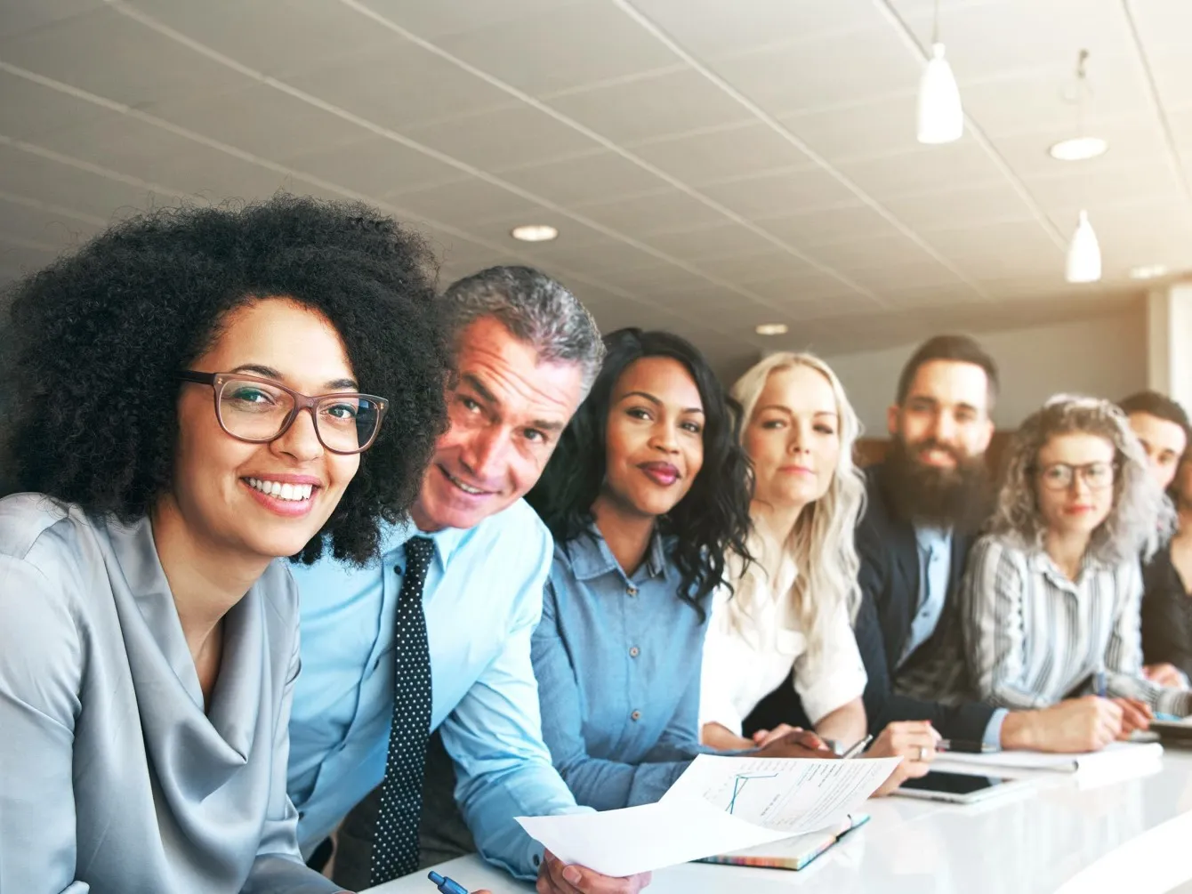 People looking at someone with the smile on their faces