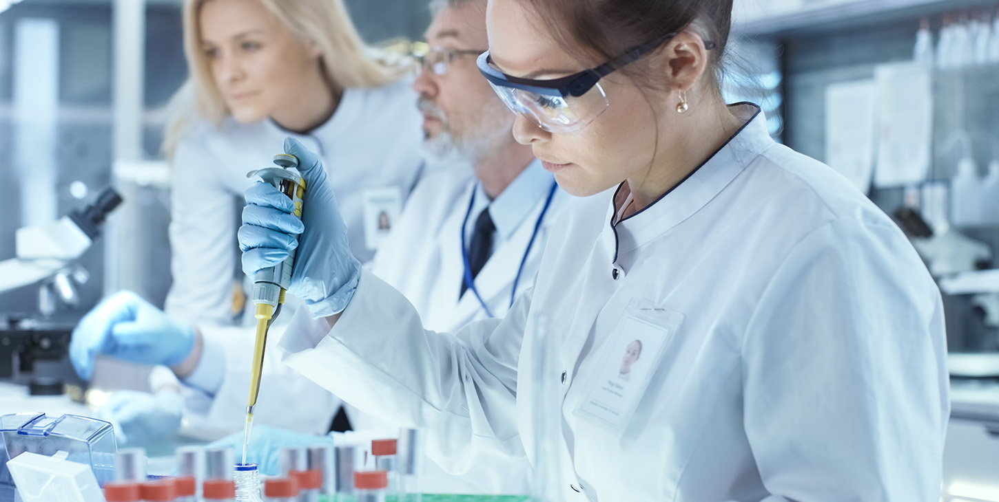 Scientist doing analysis wearing safety glasses