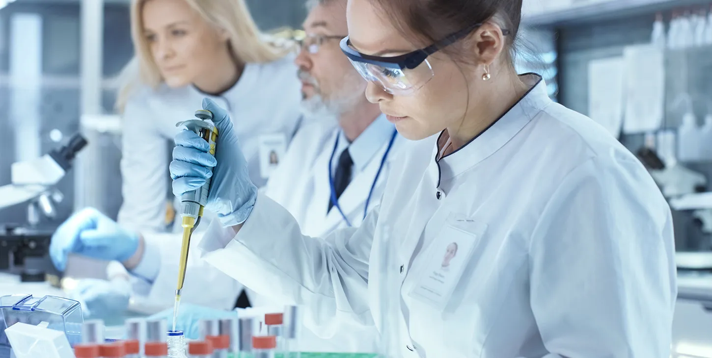 Scientist doing analysis wearing safety glasses