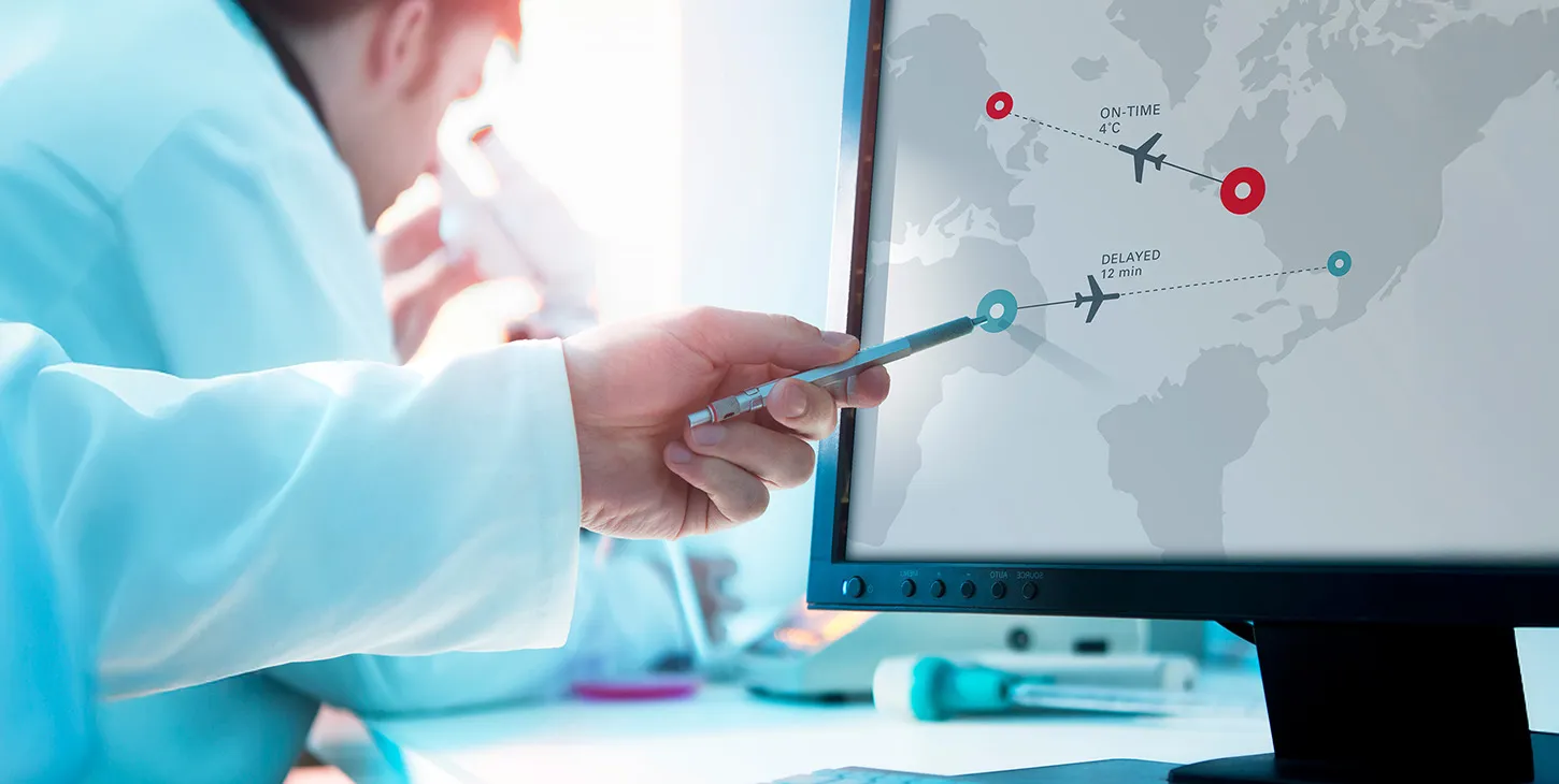 Mans hand points to a flight map on a computer screen