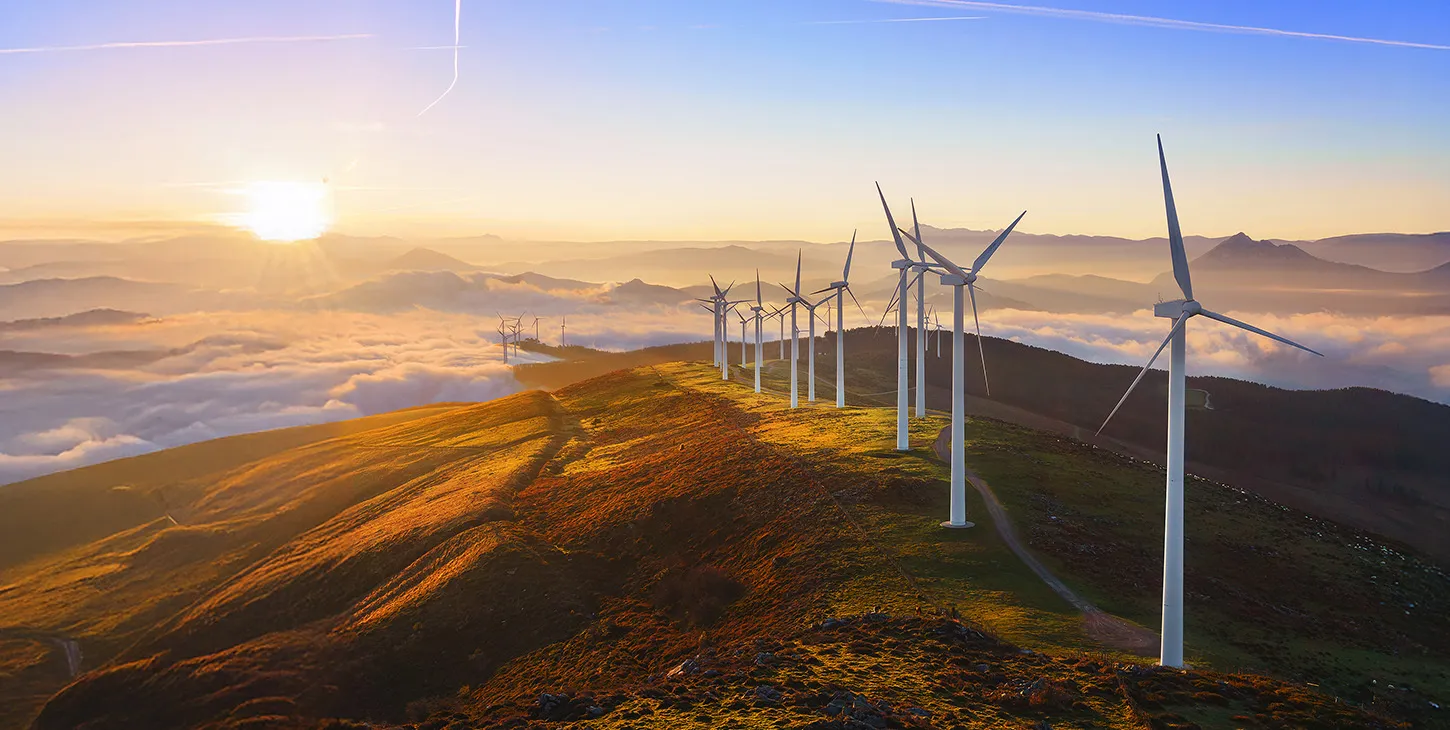 Beautiful landscape of a sunrise and wind turbines