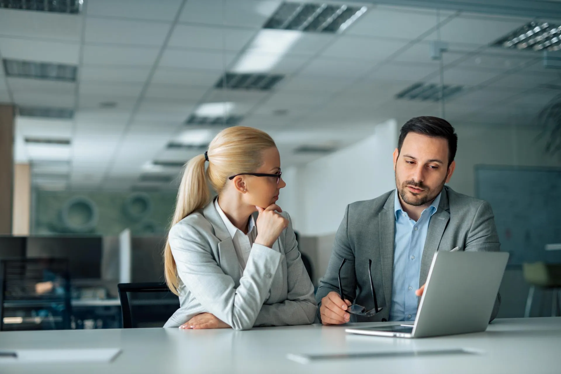 Two business people discussing work
