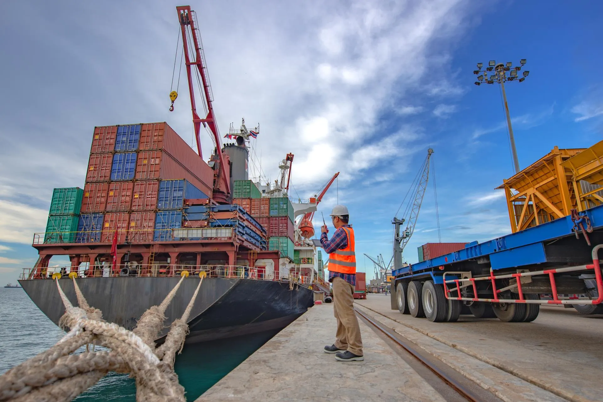the loading and discharging operation container ship vessel in port takes control by stevedore and foreman in charge, working in port terminal being for logistics and transport services to worldwide, Loading and discharging operation container ship