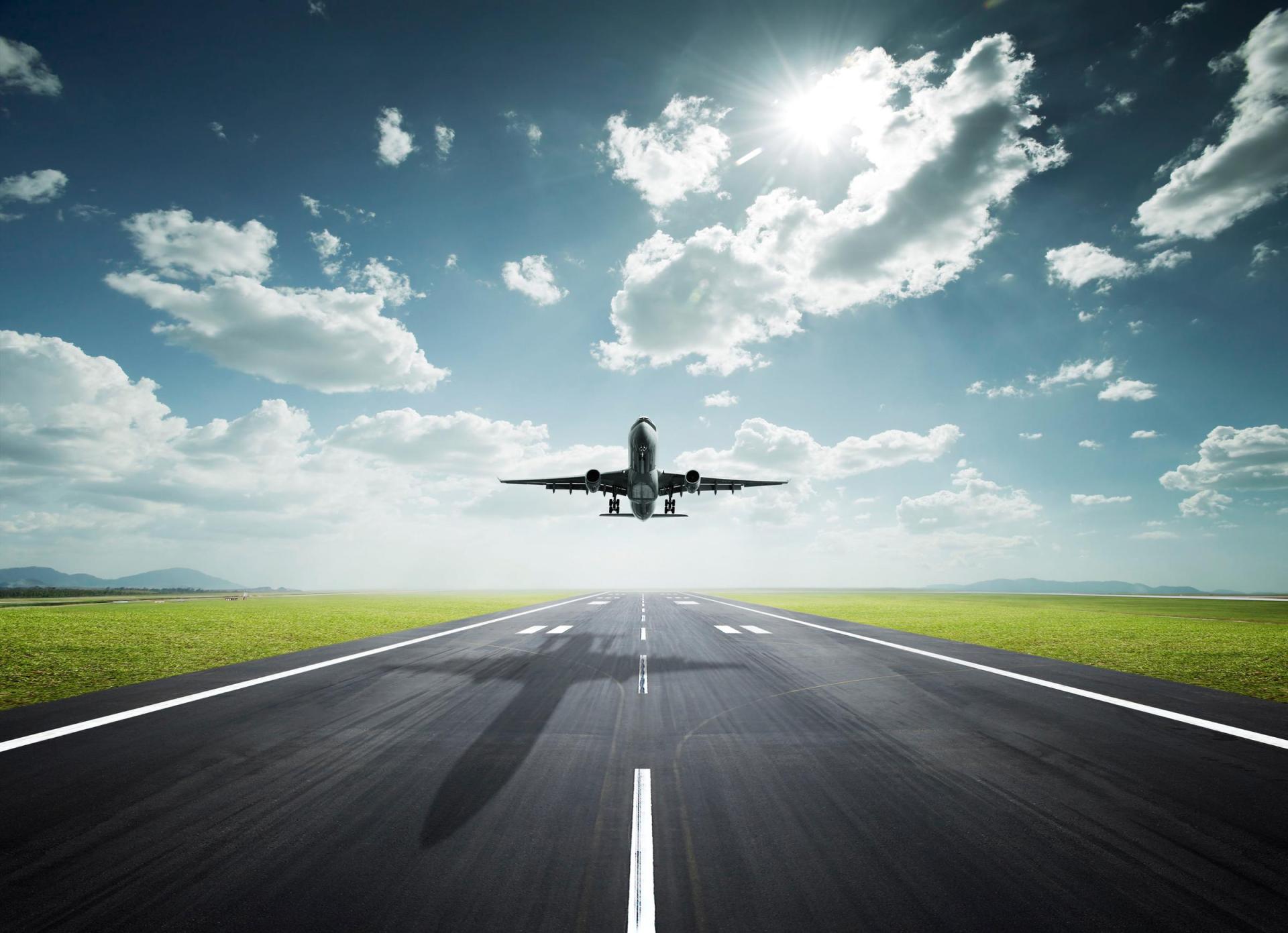 Plane taking off on a sunny day
