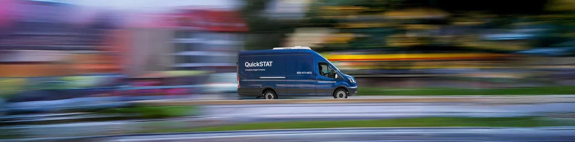 Blue van with a QuickSTAT logo on the side