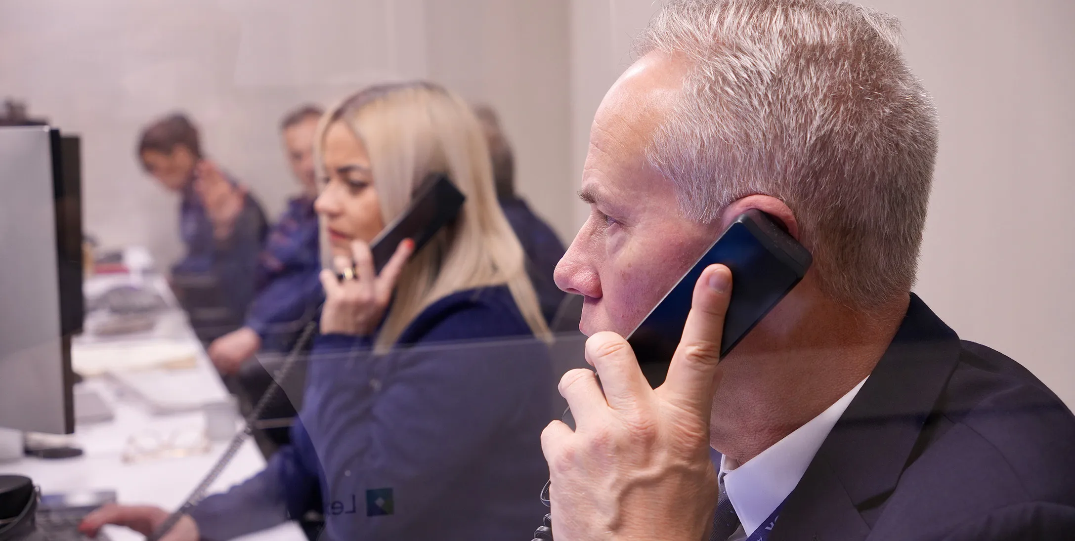 Employees talking on the phone in the office