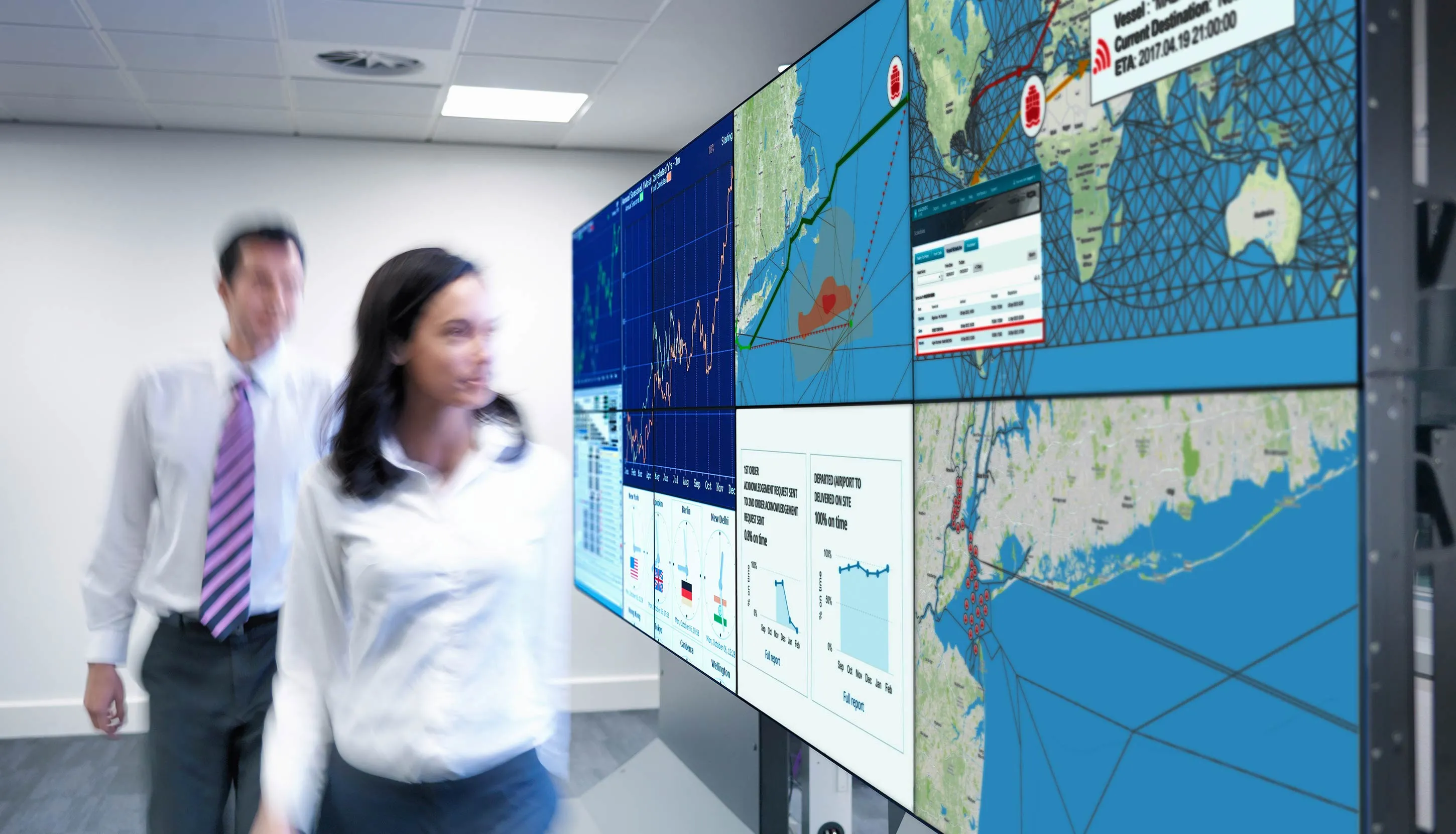 Colleagues looking at the map on a big screens