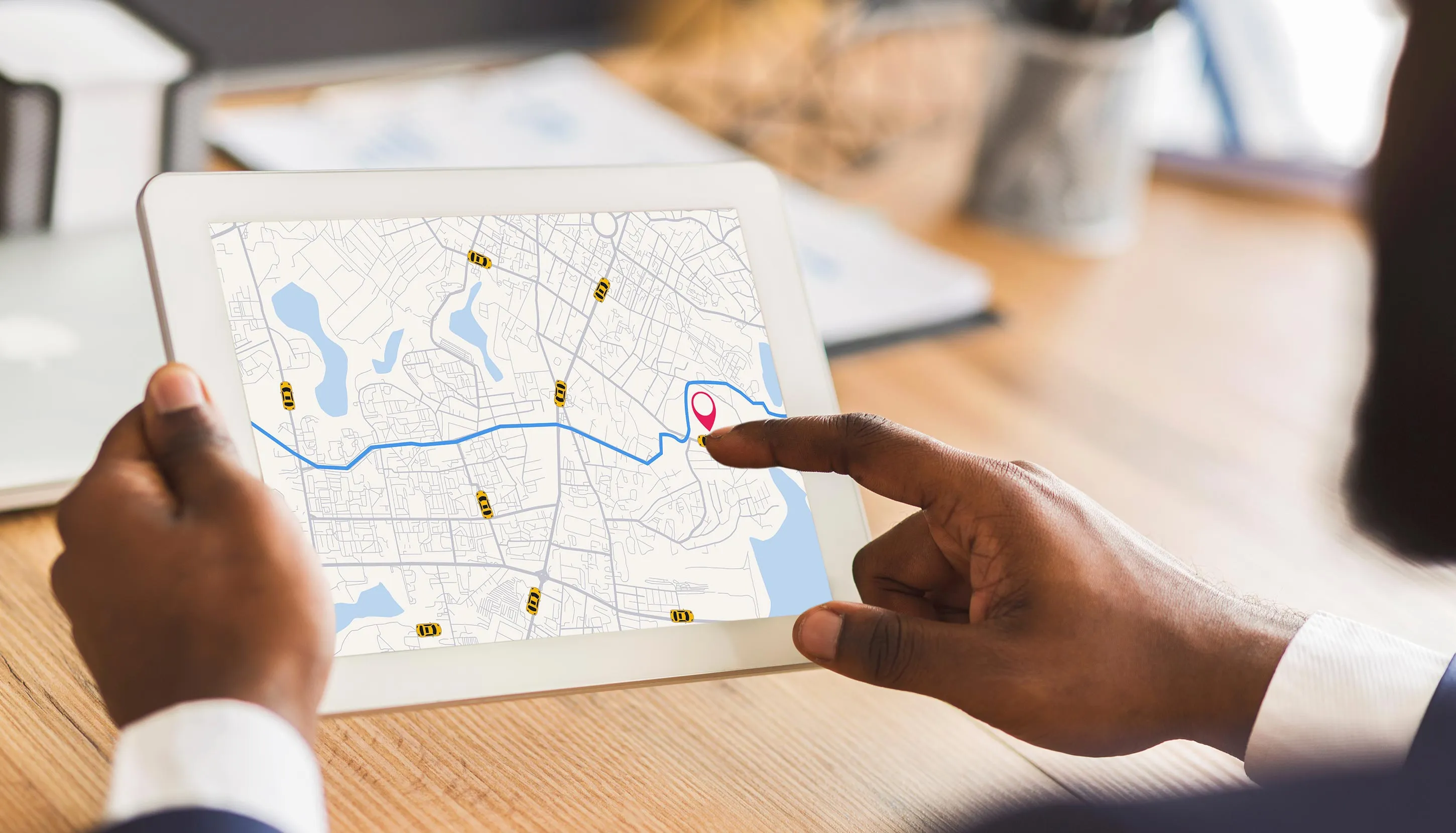 Tablet in hands of someone looking at maps