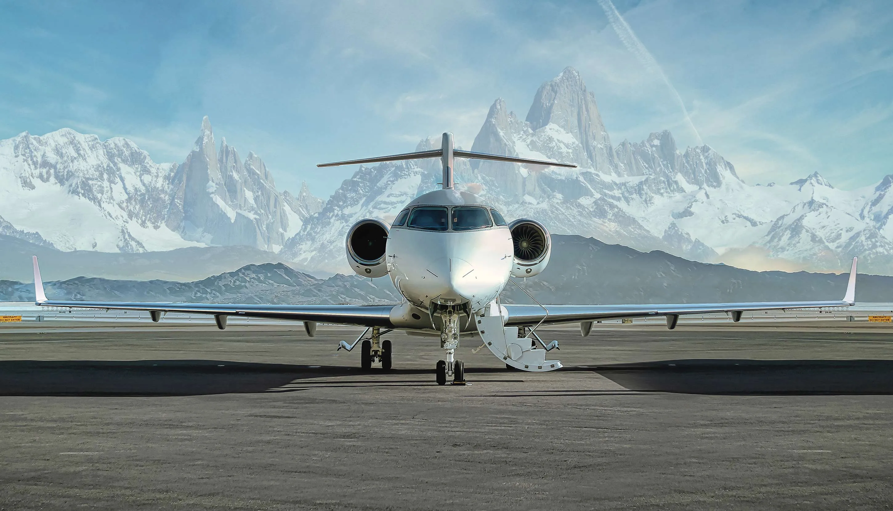 Private aviation airplane on a runway overlooking the mountains