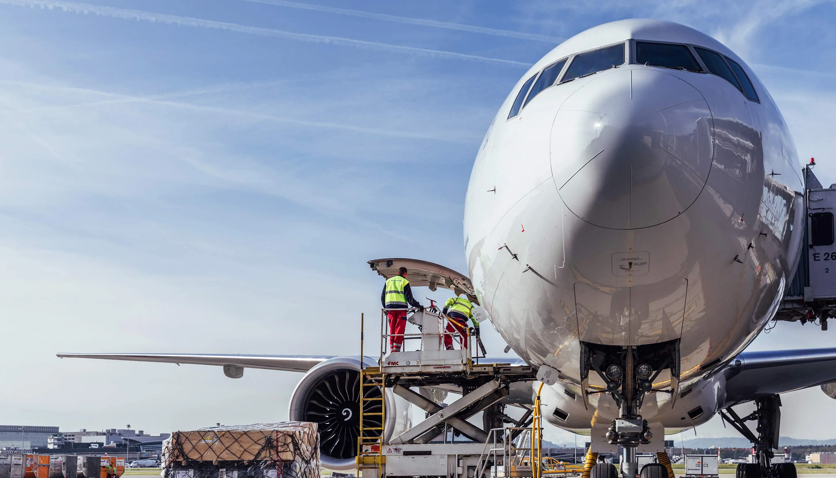 Front view of a big white plane at the airport