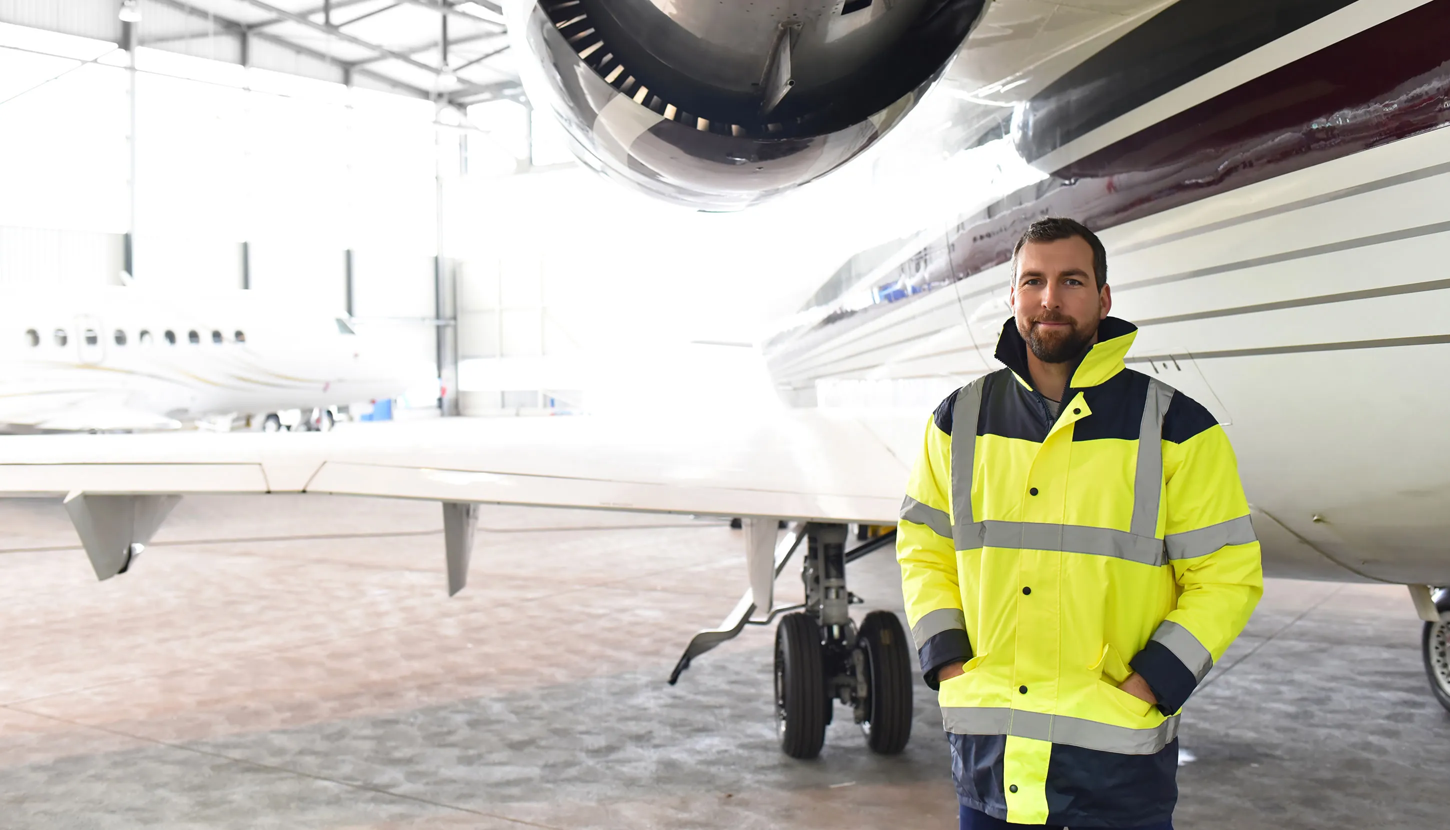 Man standing next to the plane