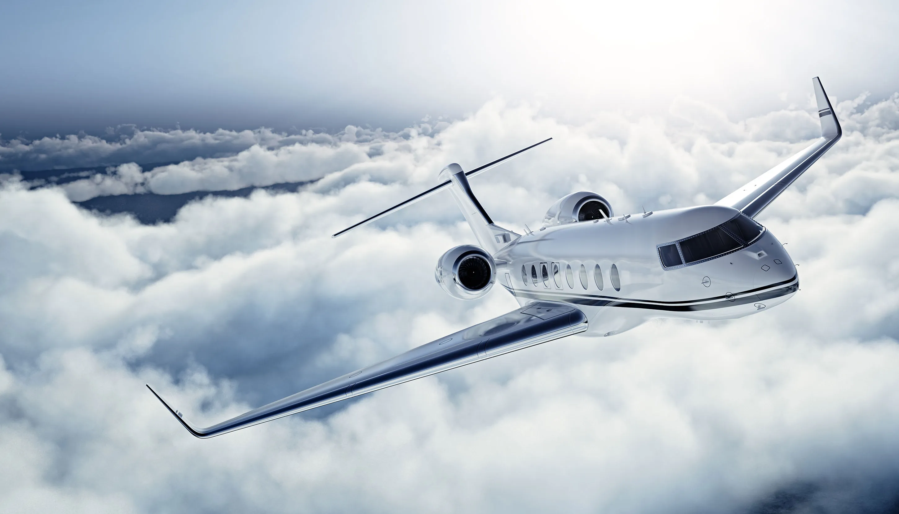Airplane above clouds during the sunny day