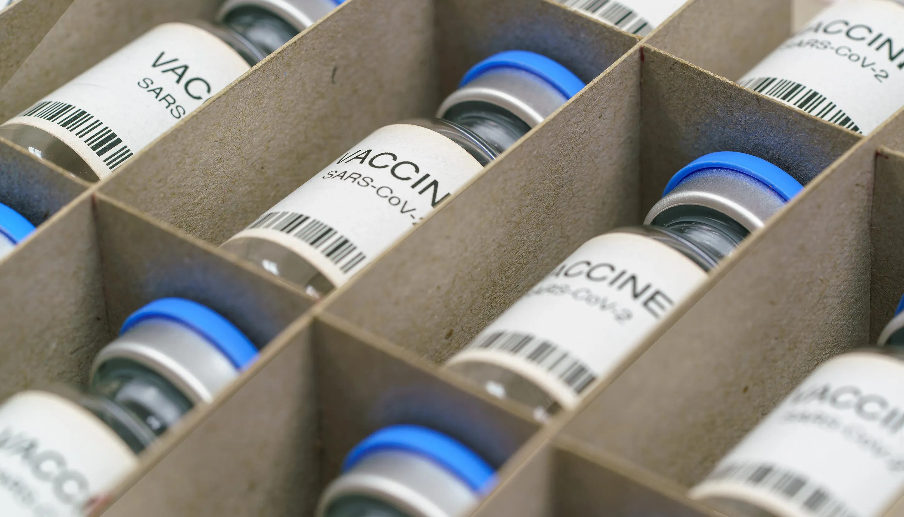 A box full of vaccine bottles