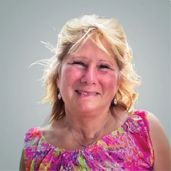 Mid aged blonde woman smiling